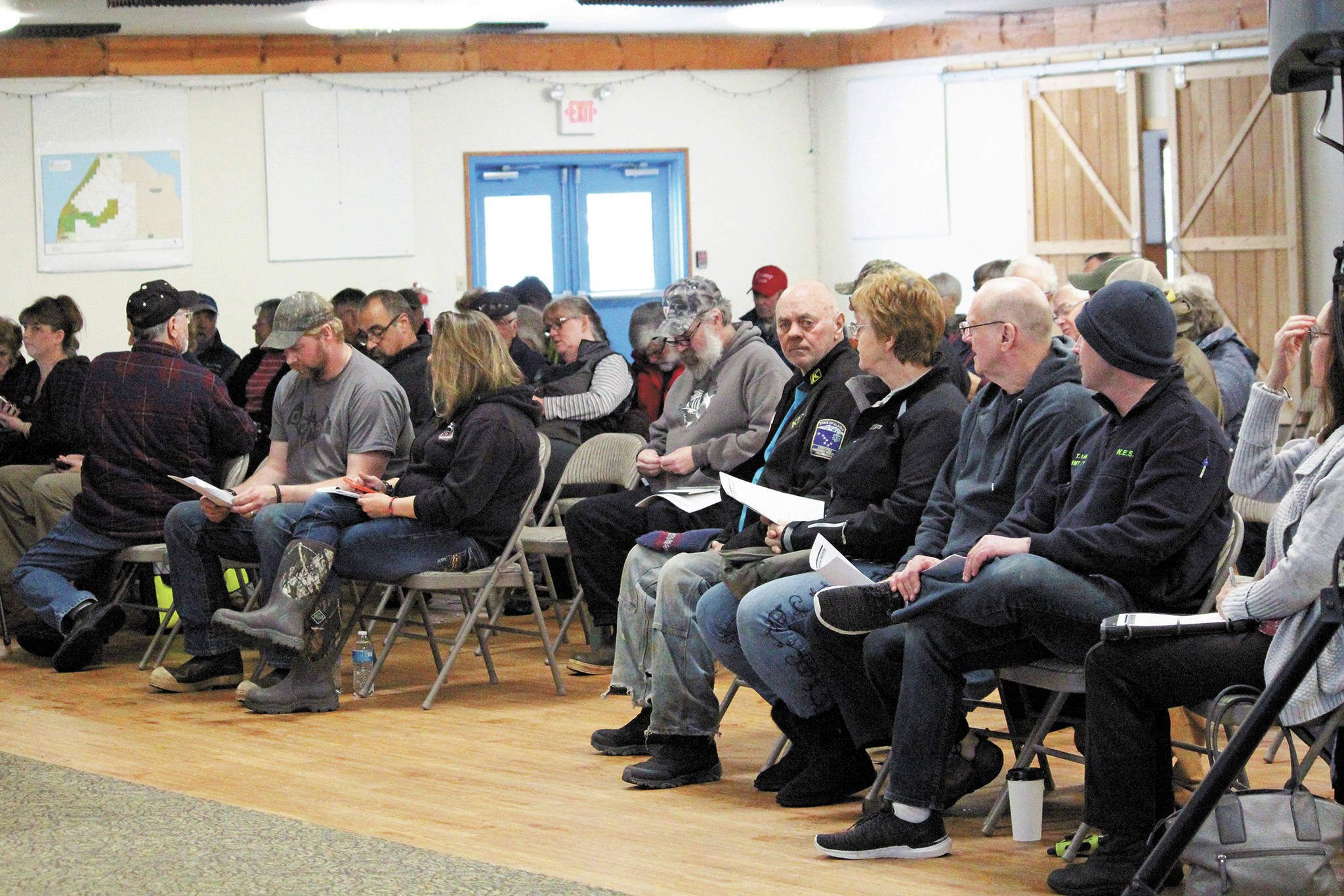 Members of the Ninilchik community wait to hear a presentation by Kenai Peninsula Borough staff during a public hearing Monday, March 9, 2020 at the Kenai Peninsula Fairgrounds in Ninilchik, Alaska. The public hearing was to gather input on whether people in Ninilchik would want to pursue an official borough service area for fire and EMS services. (Photo by Megan Pacer/Homer News)