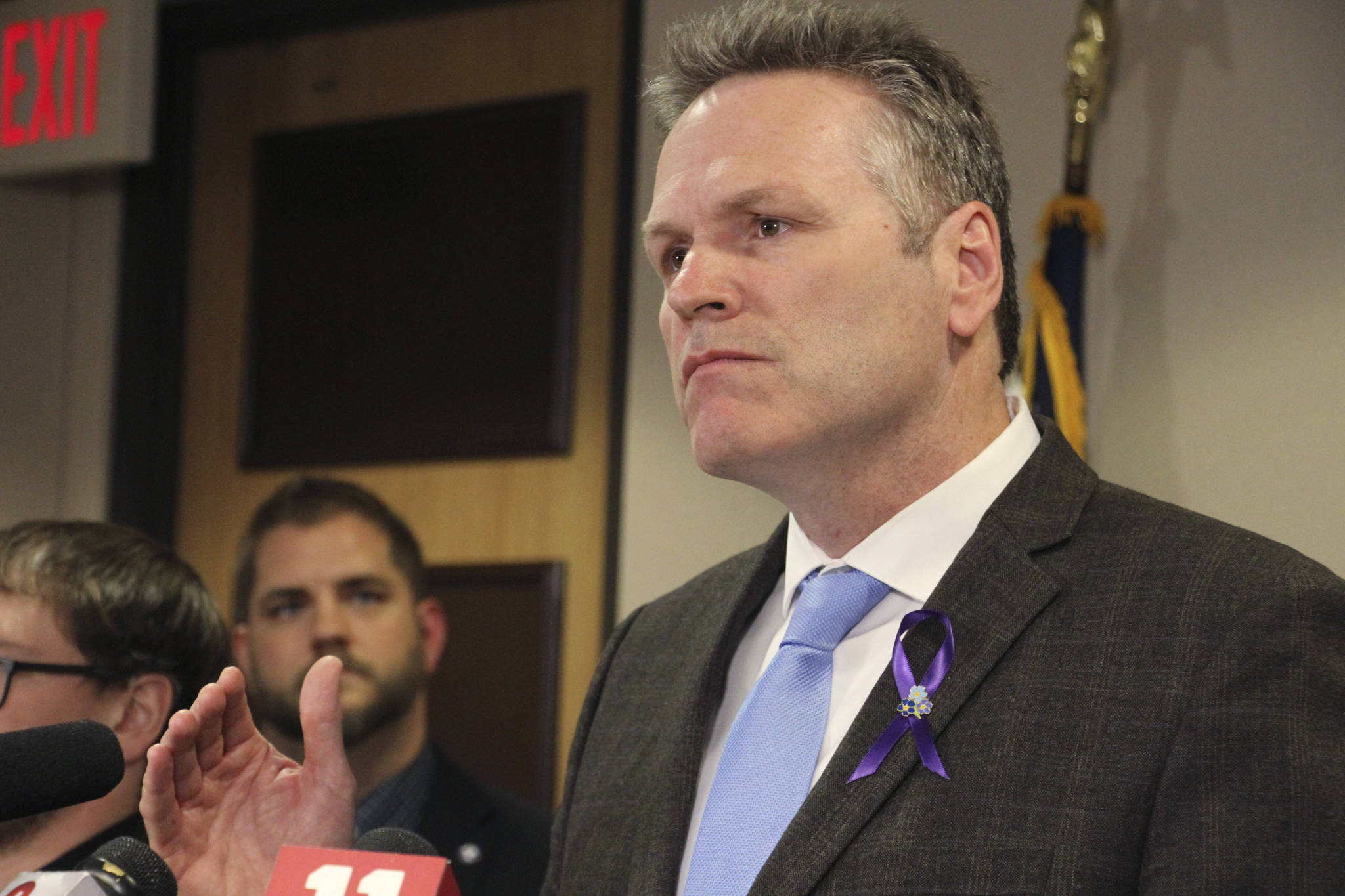 Alaska Gov. Mike Dunleavy announces the state of Alaska has its first positive case of the new coronavirus, during a news conference Thursday, March 12, 2020, in Anchorage, Alaska. Health officials said the adult male, a foreign national, self-isolated himself before going to an Anchorage hospital, where he was tested. The man was not in a life-threatening situation and was in isolation after being released from the hospital. (AP Photo/Mark Thiessen)