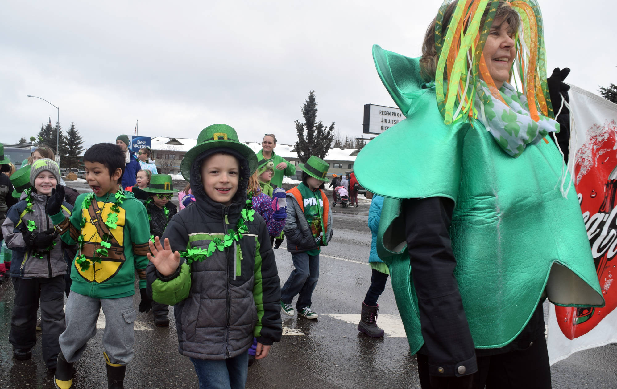 Kalifornsky Beach Elementary School’s first grade class marchs in the Soldotna St. Patrick’s Day parade along the Kenai Spur Highway on Saturday. (Photo by Kat Sorensen/Peninsula Clarion)