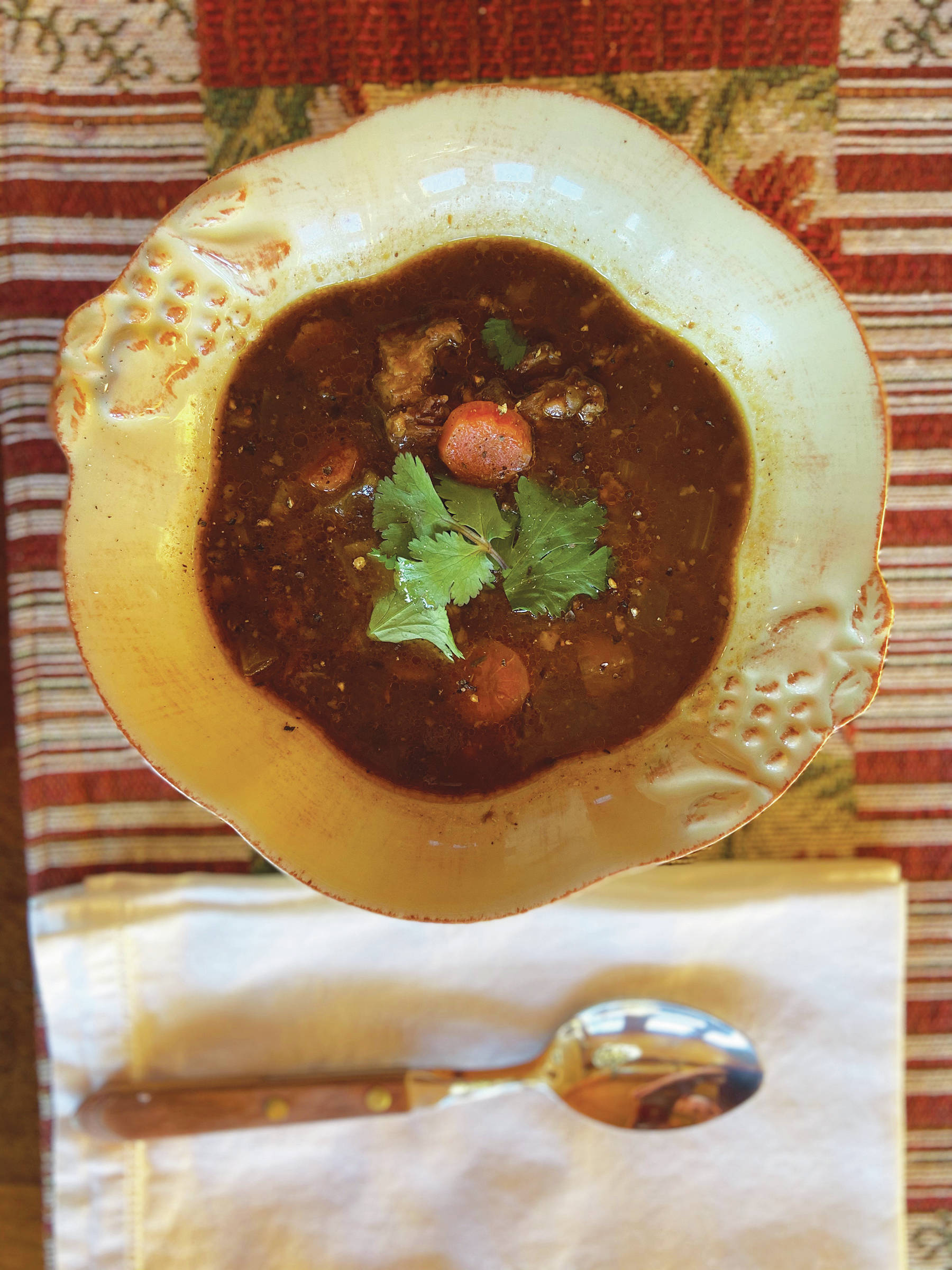 The secret ingredients in Teri Robl’s Oxtail Soup with Root Vegetables and Barley are beef oxtails, as seen here in a soup she made in her kitchen on March 10, 2020, in Homer, Alaska. (Photo by Teri Robl)