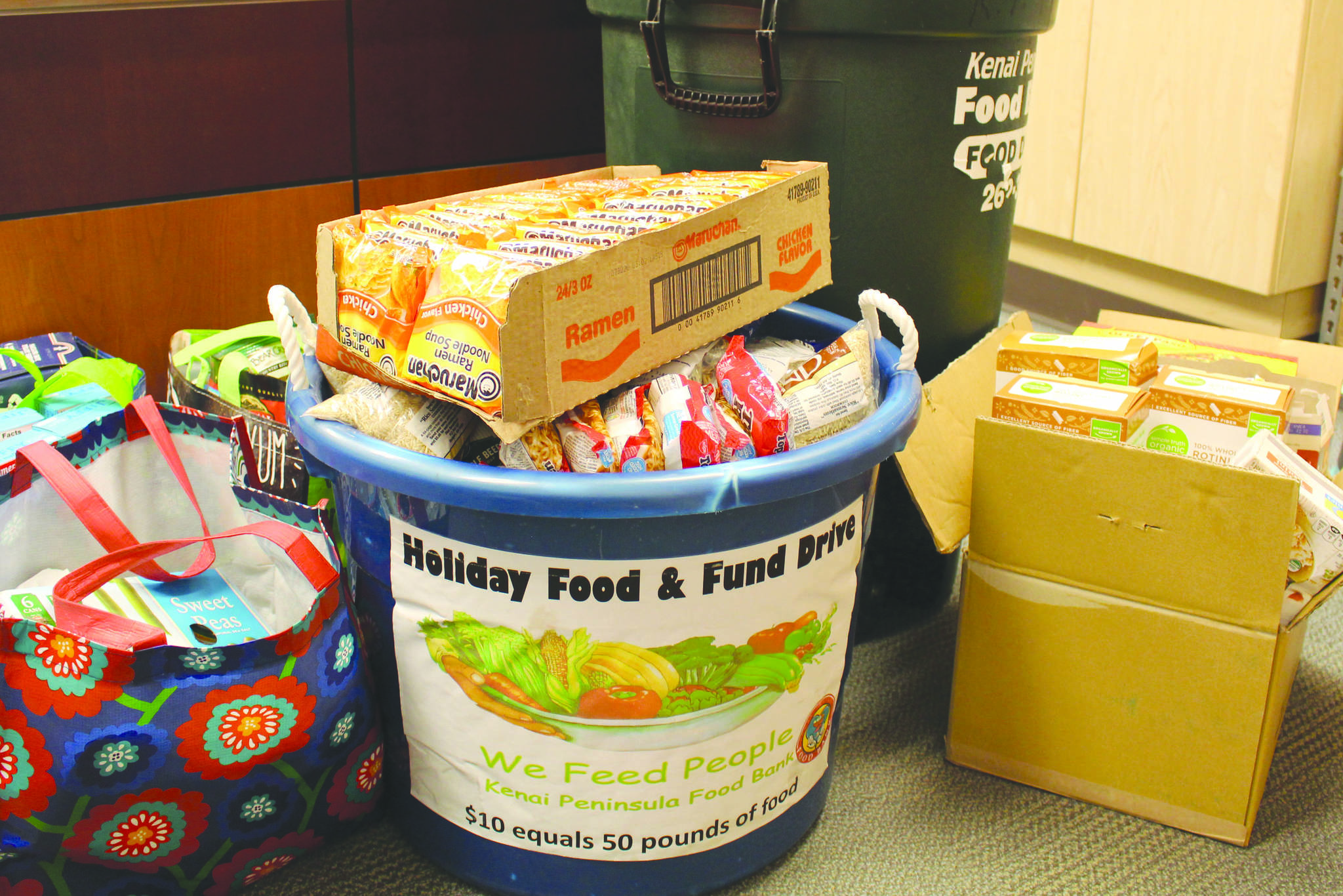 Food to be donated to the Kenai Peninsula Food Bank can be seen here at the Soldotna Public Library on Sept. 20, 2019. (Photo by Brian Mazurek/Peninsula Clarion)