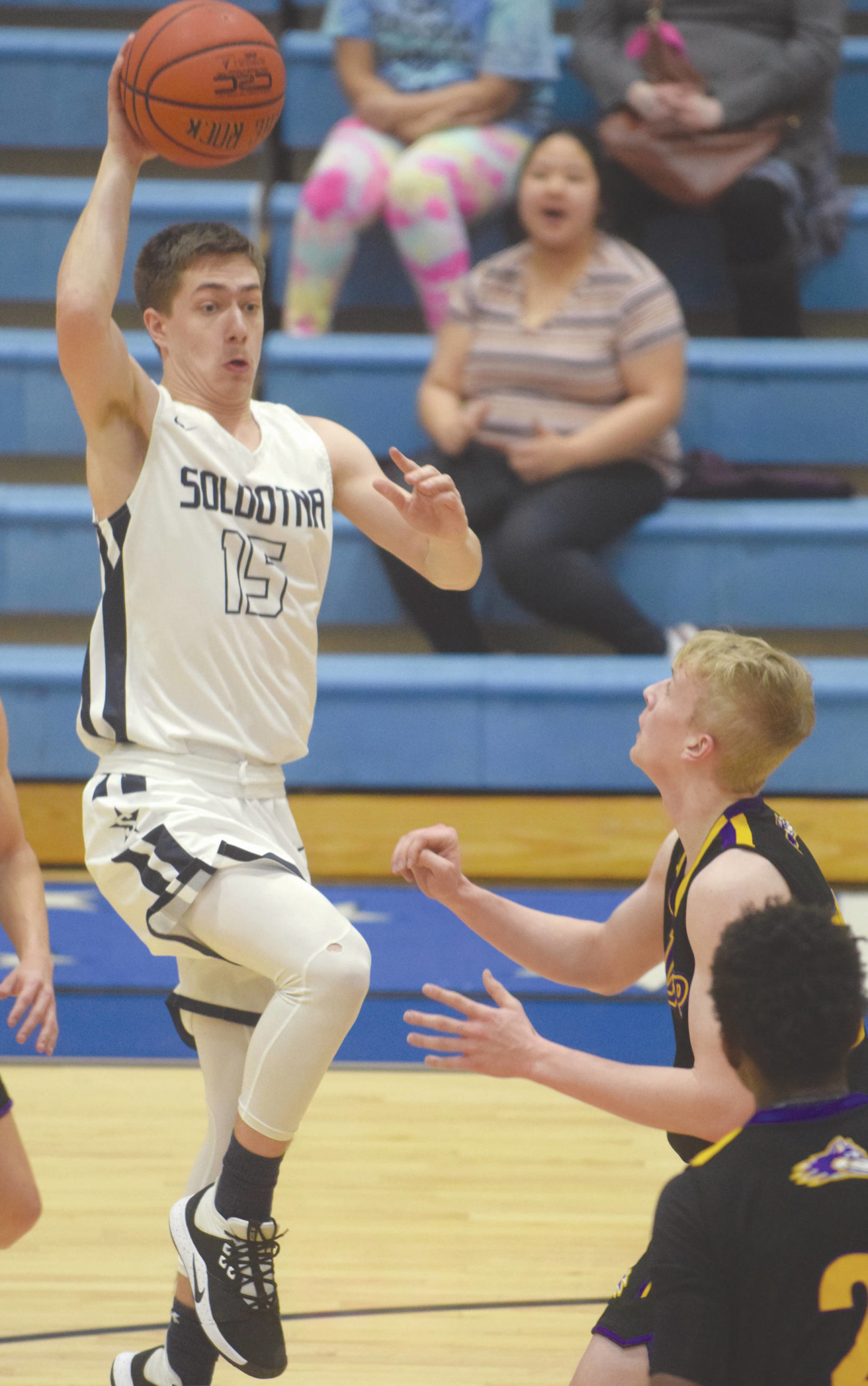 Soldotna’s Jersey Truesdell drives the lane on Lathrop’s Ben Krastra on Friday, Feb. 7, 2020, at Soldotna High School in Soldotna, Alaska. (Photo by Jeff Helminiak/Peninsula Clarion)