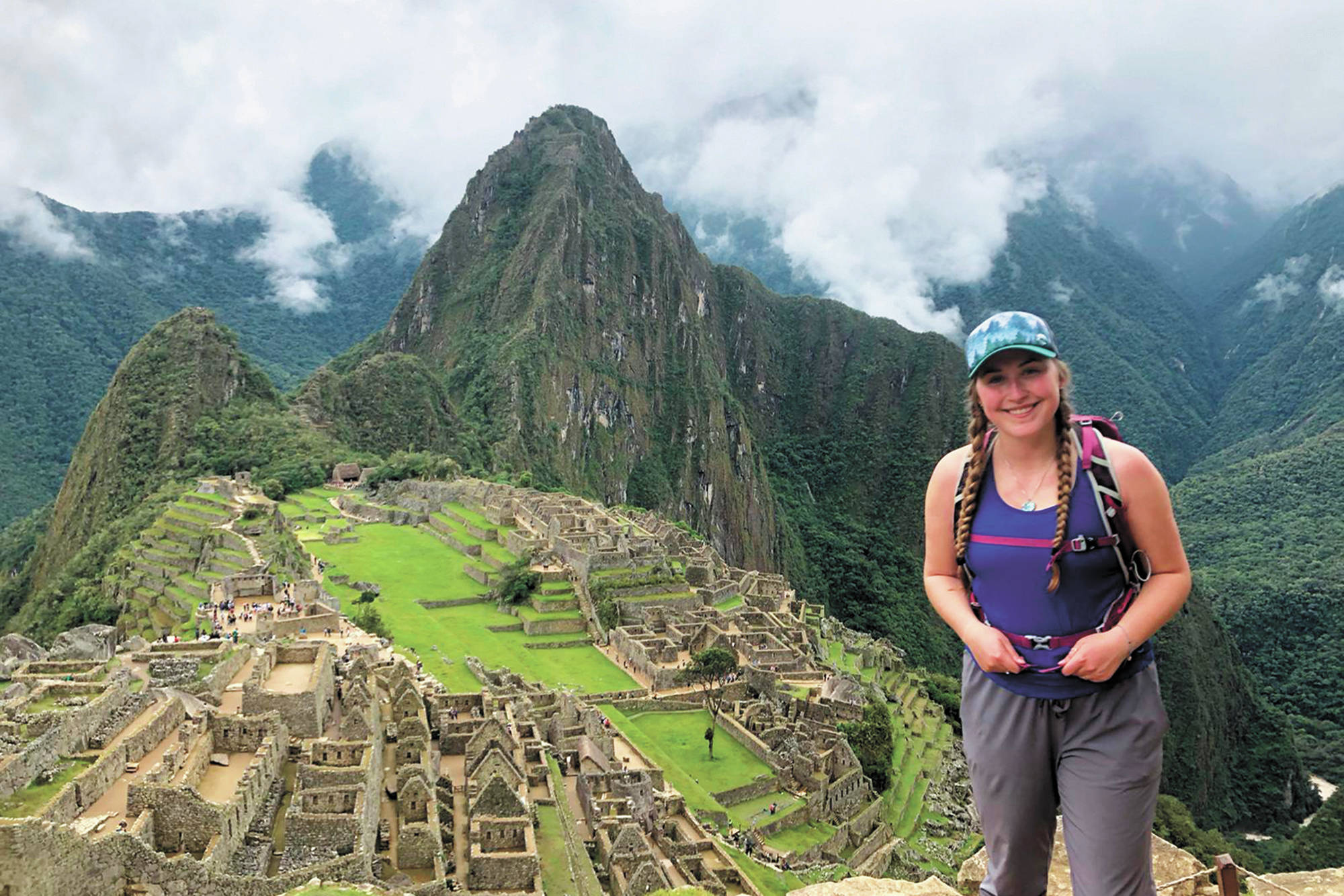 Brenna McCarron, a Homer High School graduate stuck in Peru after the country closed its borders to stem the spread of the novel coronavirus, stands at Machu Picchu, Peru. She is one of about 19 Alaskans stranded in the country. (Photo courtesy Brenna McCarron)