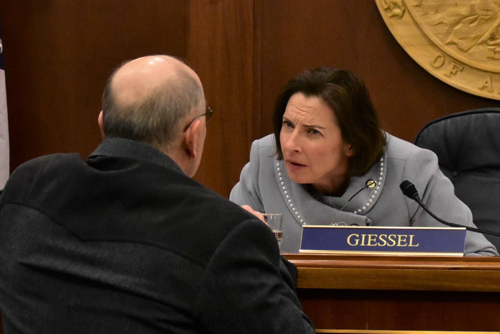 Peter Segall | Juneau Empire                                Senate President Cathy Giessel, R-Anchorage, speaks to Sen. Click Bishop, R-North Pole, on Monday.