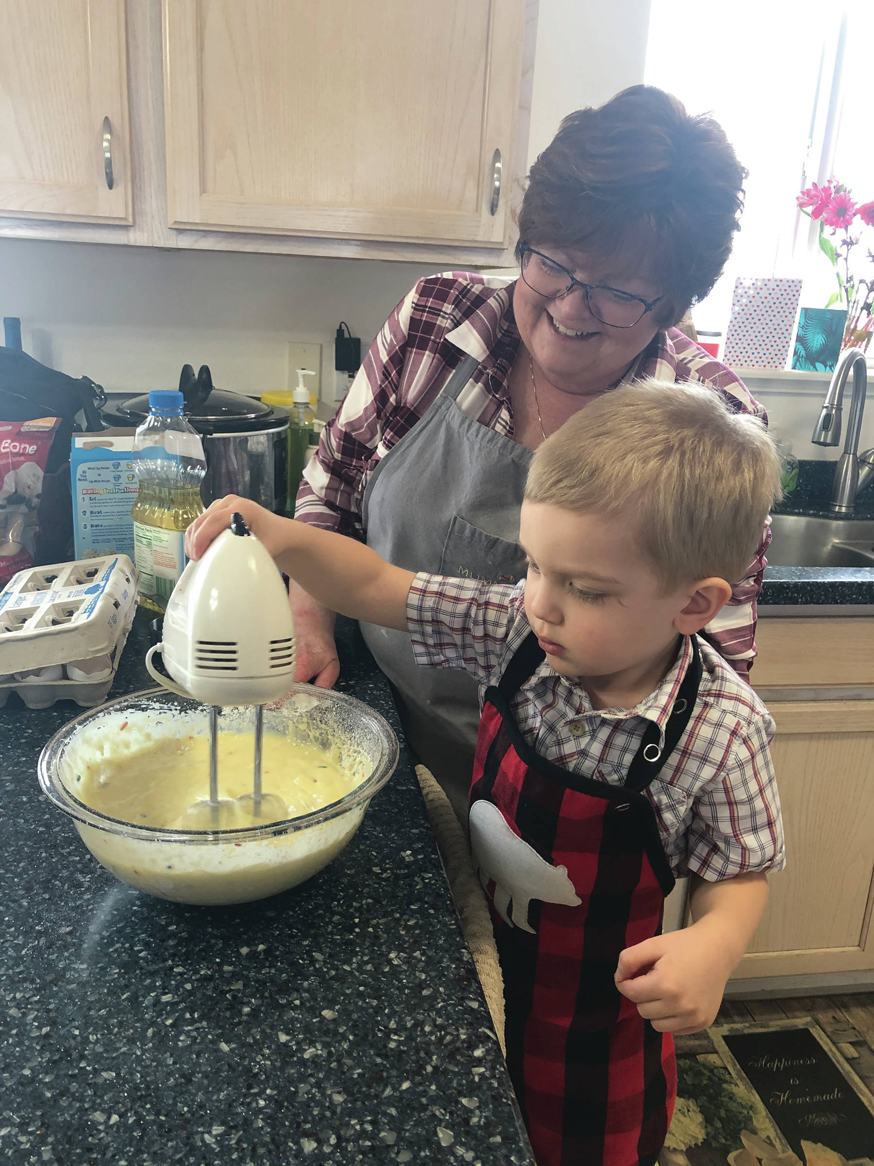 Grandson Kase and Nani, his grandmother Teri Robl, make cupcakes for his 3rd birthday on March 21, 2020, at his home in Anchorage, Alaska. (Photo courtesy Alyssa Robl)