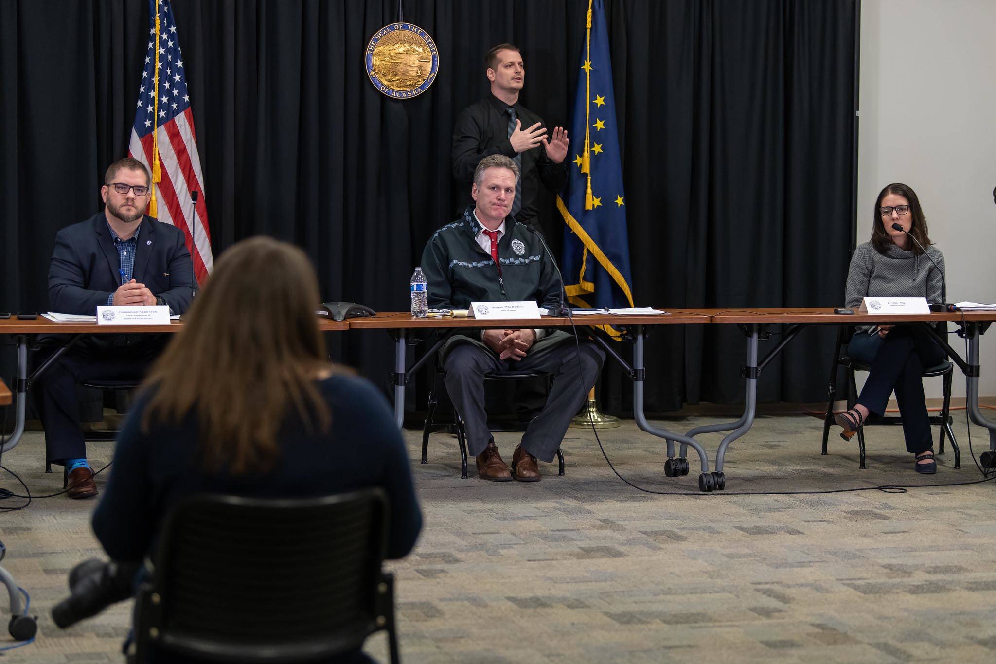 From left: DHSS Commissioner Adam Crum, Gov. Mike Dunleavy, Chief Medical Officer Dr. Anne Zink participate in a press conference on the COVID-19 pandemic on Wednesday, March 25, 2020. (Photo courtesy Office of Gov. Mike Dunleavy)