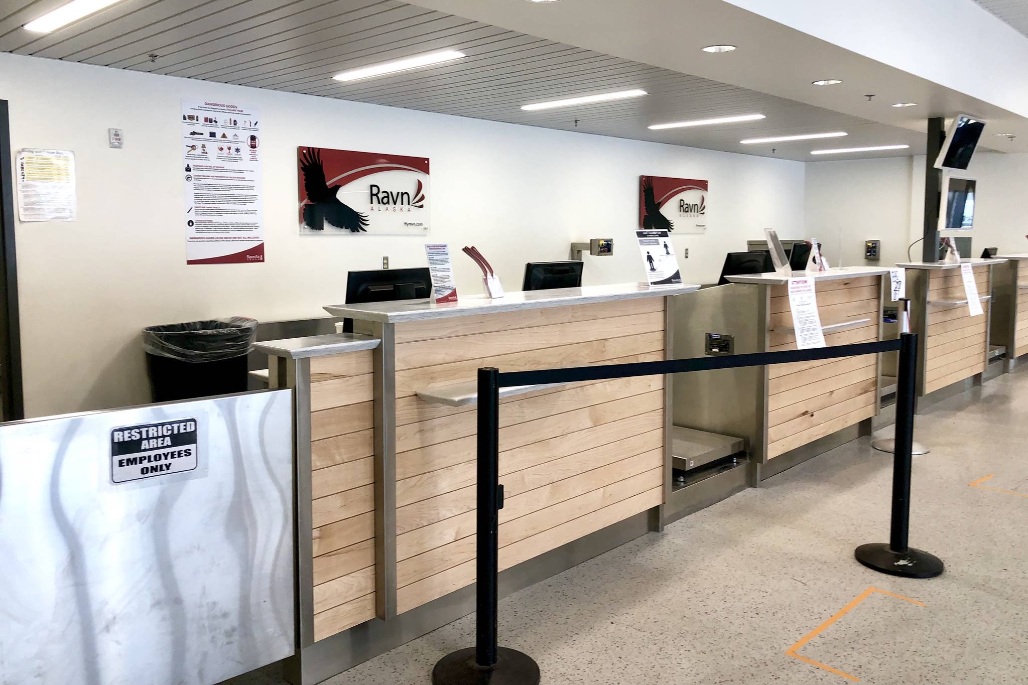 The RavnAir kiosk stands empty at the Kenai Airport on Thursday, April 2, 2020. The company announced Thursday they were cutting all service by 90%. (Photo by Victoria Petersen/Peninsula Clarion)