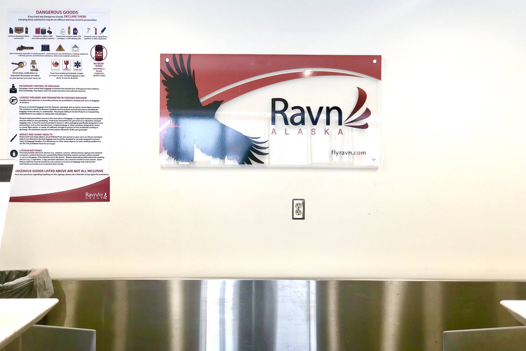 A RavinAir sign can be seen at a kiosk at the Kenai Airport on Thursday, April 2, 2020. The company announced Thursday they were cutting all service by 90%. (Photo by Victoria Petersen/Peninsula Clarion) (Photo by Victoria Petersen/Peninsula Clarion)(Photo by Victoria Petersen/Peninsula Clarion)