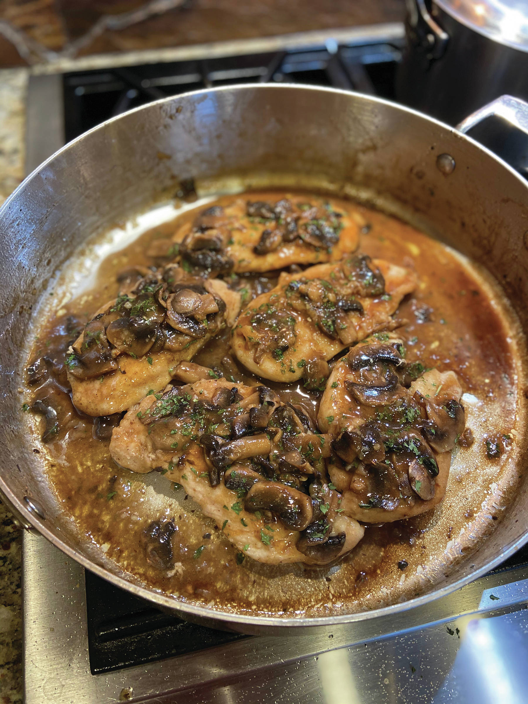 The final step to cooking chicken marsala is to cook the chicken with the browned mushrooms and marsala sauce, as seen here in a batch Teri Robl made on April 4, 2020, in her kitchen in Homer, Alaska. (Photo by Teri Robl)