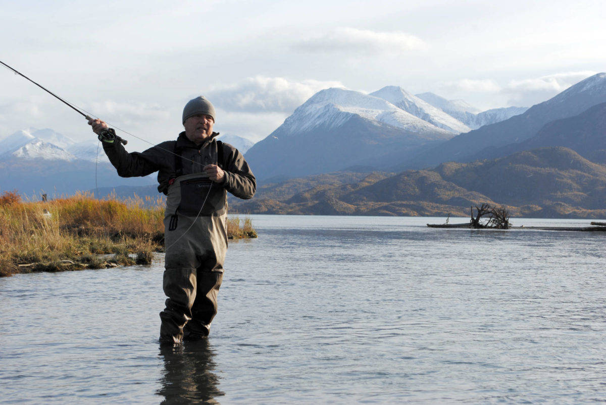 Mike Tuhy, owner and operator of the Tower Rock Lodge in Kenai casts for trout in the Upper River Kenai on Oct. 11, 2017. (Photo by Kat Sorensen/Peninsula Clarion)