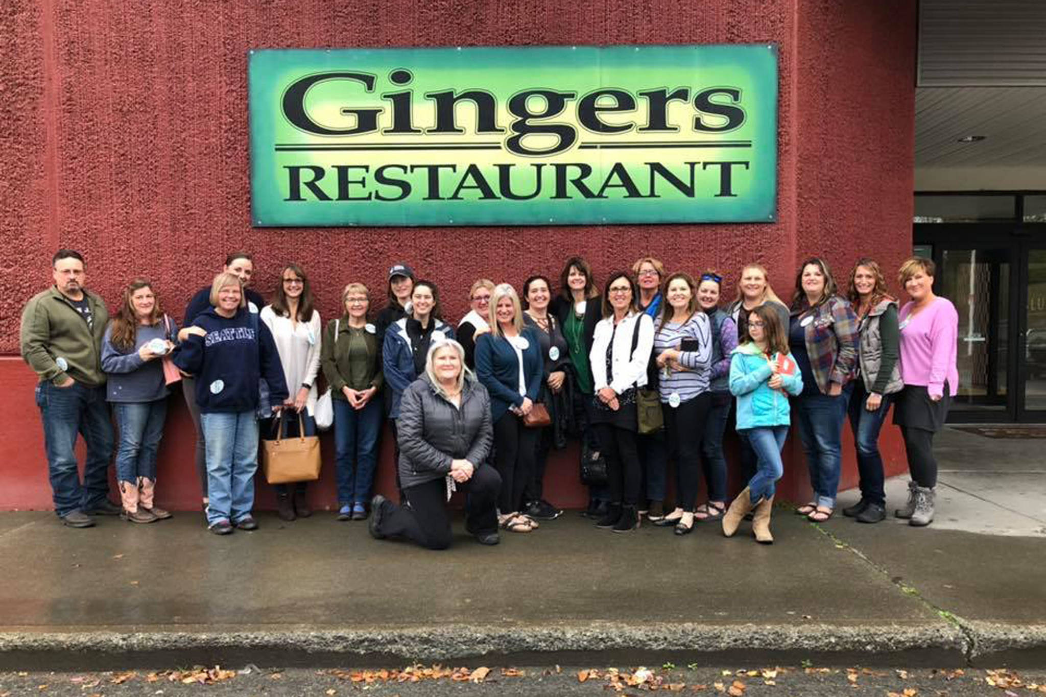 Members of the Soldotna Cash Mob stand outside Ginger’s Restaurant in Soldotna in September 2019. (Photo courtesy Rhonda McCormick)