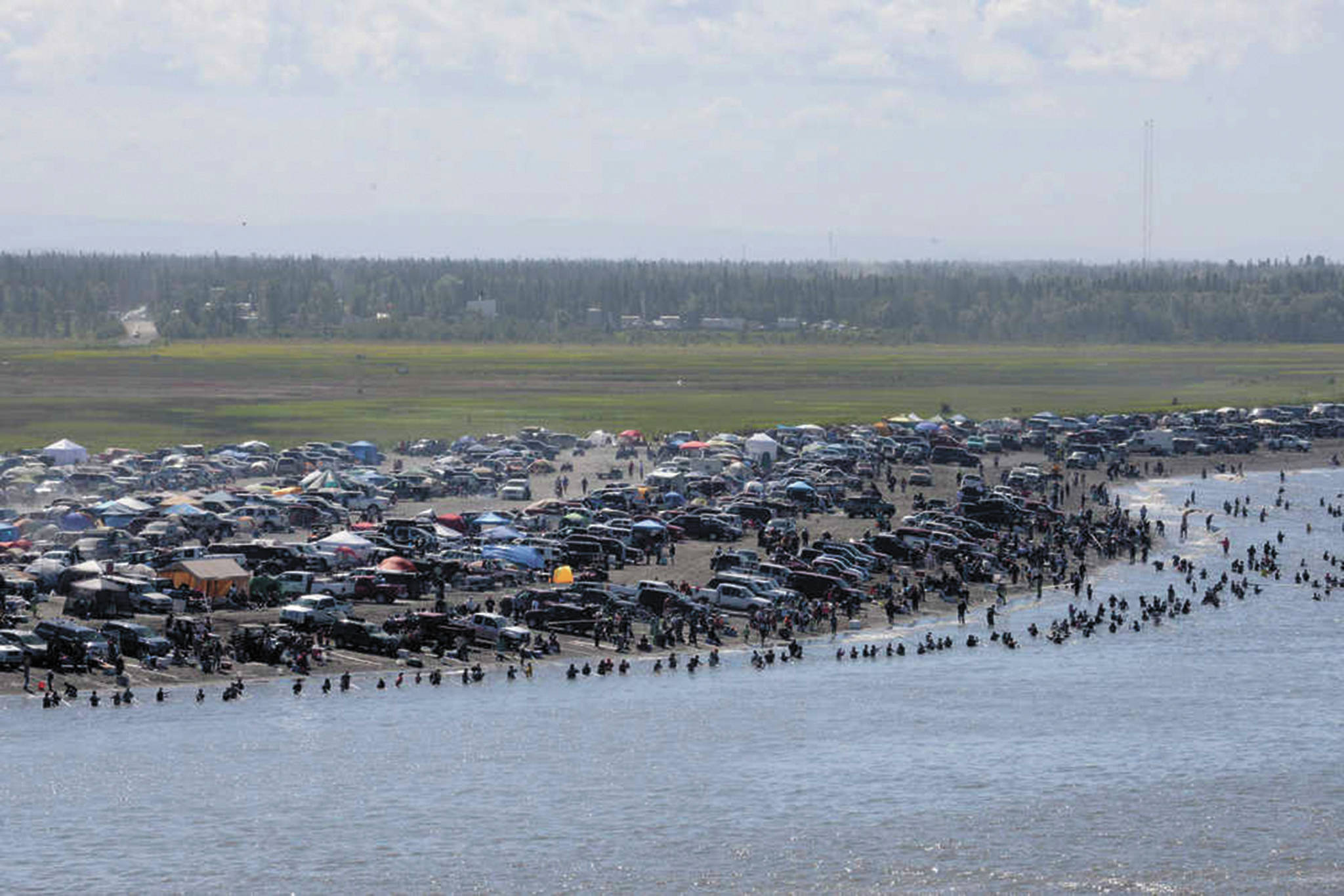In this July 20, 2013 file photo, several thousand dipnetters converged onto the mouth of the Kenai River to catch a share of the late run of sockeye salmon headed into the river in Kenai, Alaska. (Peninsula Clarion file photo/Rashah McChesney)