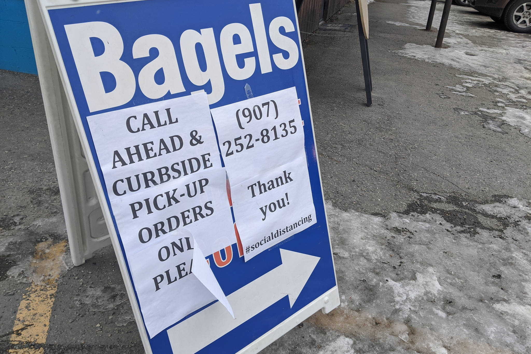 A sign announcing the pick-up only services at Everything Bagels in Soldotna, Alaska, is seen on April 1, 2020. Gov. Mike Dunleavy announced loosened restrictions on dine-in services during a press conference on Tuesday, April 21, 2020. (Photo by Erin Thompson/Peninsula Clarion)