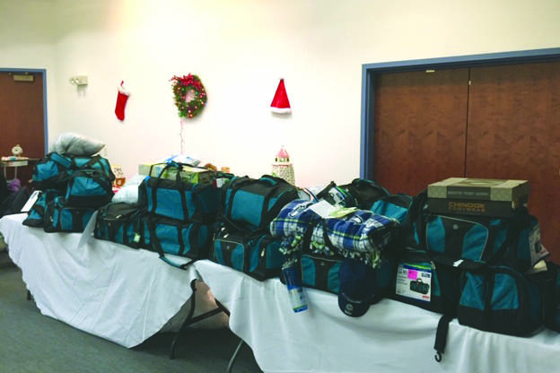 Photo courtesy of Kelly Martin                                 Thirty duffel bags filled by the Kenai Peninsula Association of Realtors for children in the Kenai Peninsula Borough School District’s Students in Transition Program are photographed in December 2018 in Kenai.
