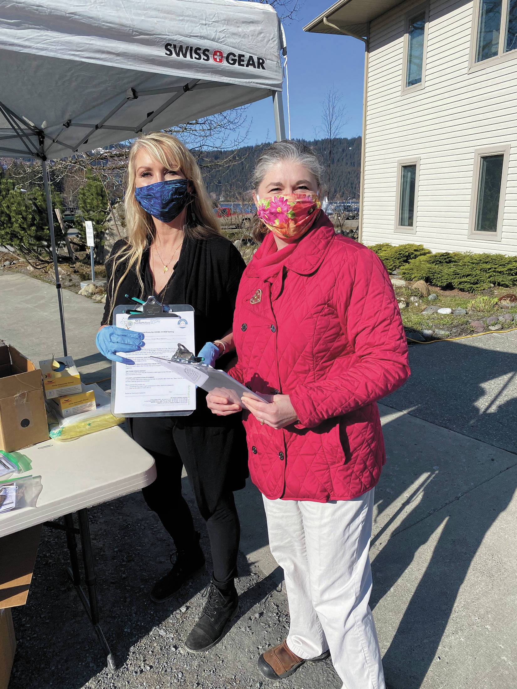Seldovia Village Tribe CEO Crystal Collier, left, and SVT Health and Wellness Center Prevention Coordinator Shannon Custer, right, conduct free COVID-19 testing on Wednesday, April 29, 2020 in Seldovia, Alaska. (Photo courtesy Seldovia Village Tribe)