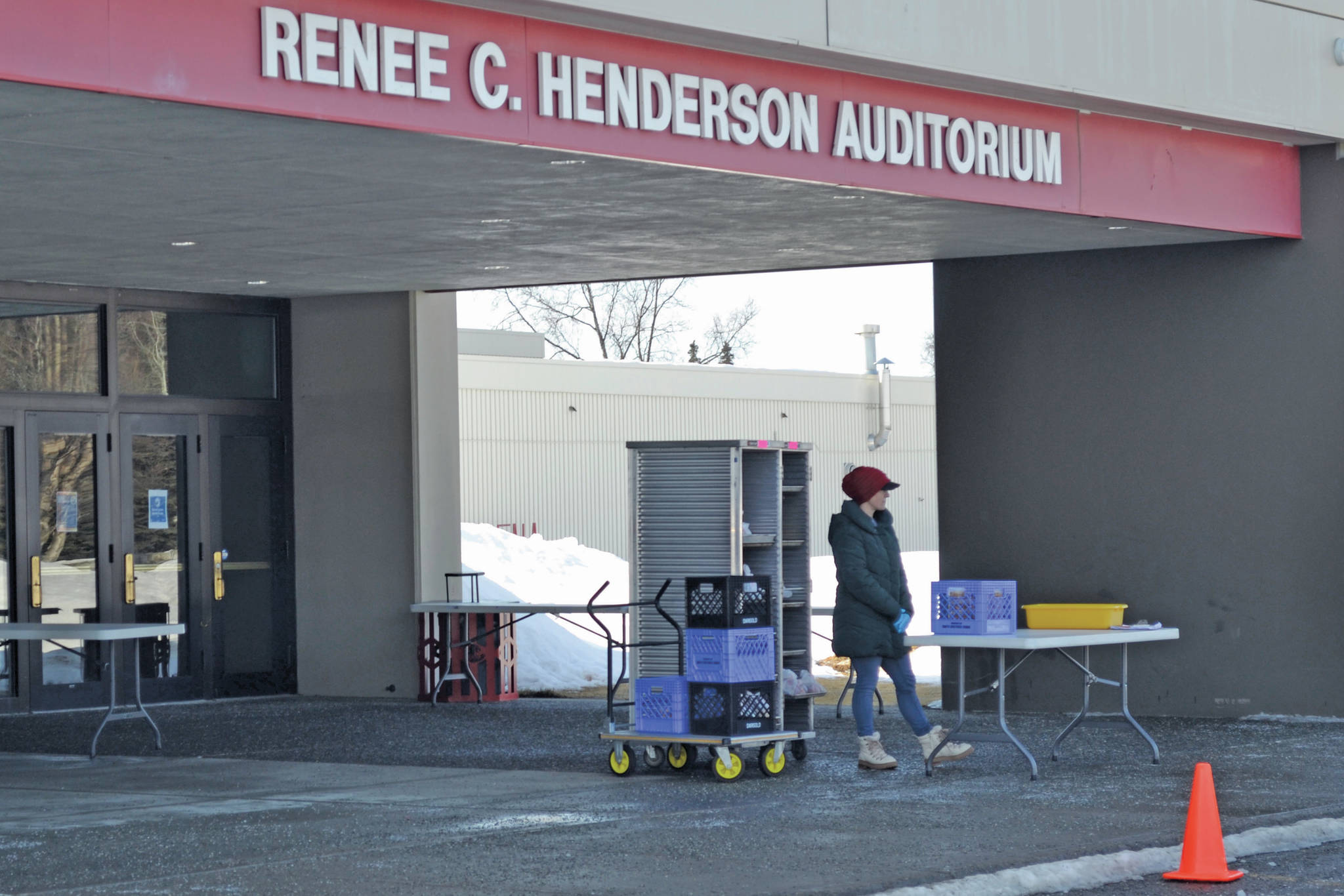 Kenai Peninsula Borough School District staff distribute student meal for lunch at Kenai Central High School on March 25, 2020, in Kenai, Alaska. (Photo by Victoria Petersen/Peninsula Clarion)