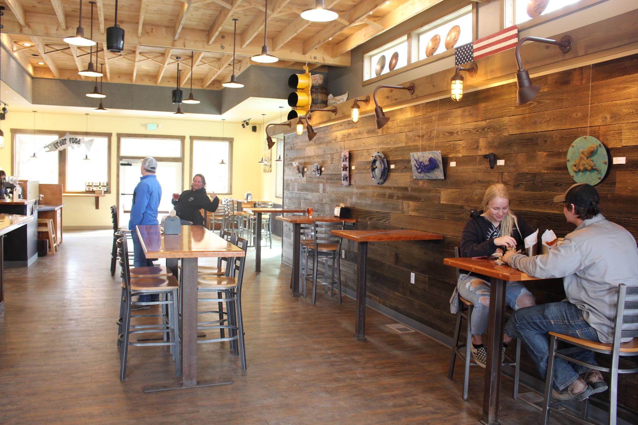 Kenai Peninsula residents eat inside Kenai River Brewing Company in Soldotna, Alaska on May 8, 2020. Friday was the first day that restaurants around the state began opening for dine-in services without the need for a reservation. (Photo by Brian Mazurek/Peninsula Clarion)