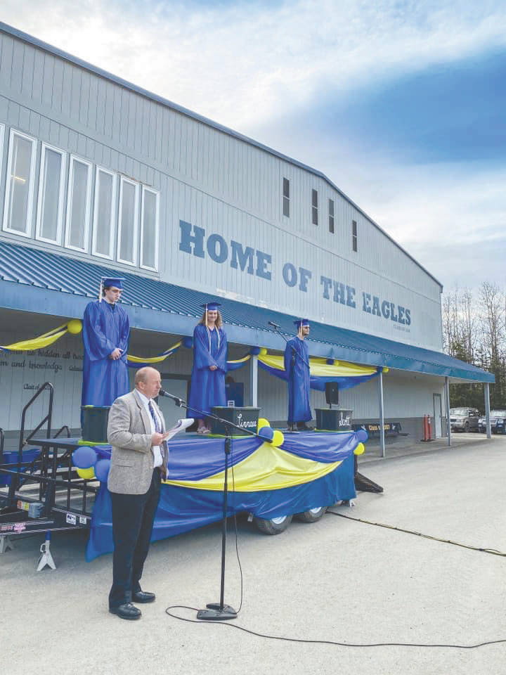 Photo submitted by Karen McGahan                                 Robert Walsh (from left), Linnanae Dohse and Scott Loehr graduate from Cook Inlet Academy on Saturday.