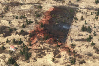 This aerial photo shows how retardant was used to slow the advance of a wildfire toward cabins threatened by the Murray Fire in the Caribou Hills on Sunday, May 10, 2020 near Ninilchik, Alaska. (Photo by Duane Morris/Alaska Division of Forestry)