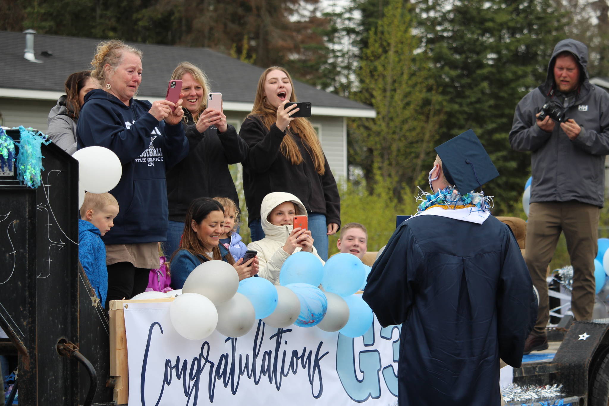 Friends and family of Galen Brantley III cheer him on as he graduates from Soldotna High School on May 18, 2020. (Photo by Brian Mazurek/Peninsula Clarion)