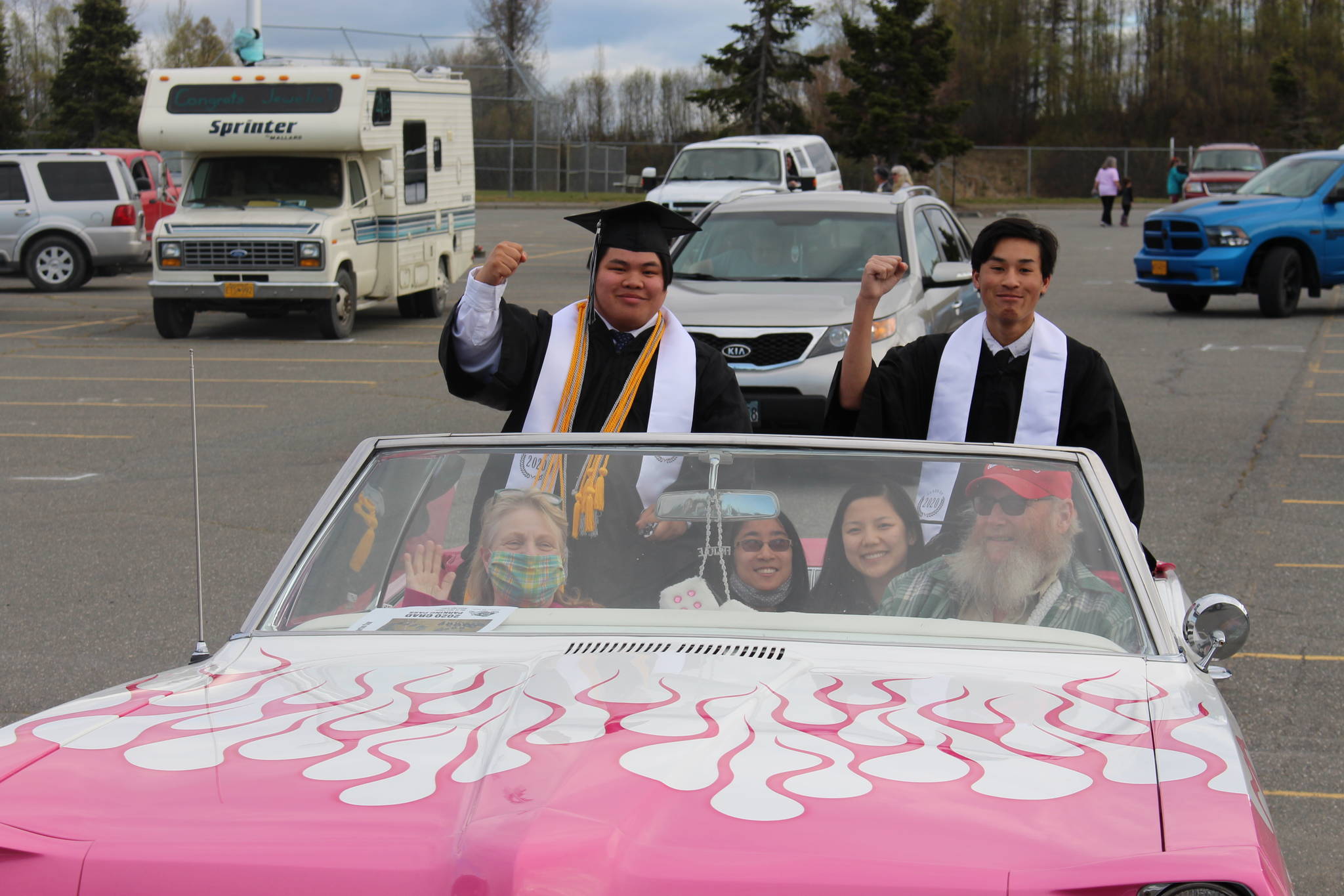 Nikiski High School seniors Hamilton “Hammie” Cox, left, and Martin Cox III, right, smile for the camera during the 2020 Nikiski High School Graduation Commencement Ceremony in Nikiski, Alaska on May 19, 2020. (Photo by Brian Mazurek/Peninsula Clarion)