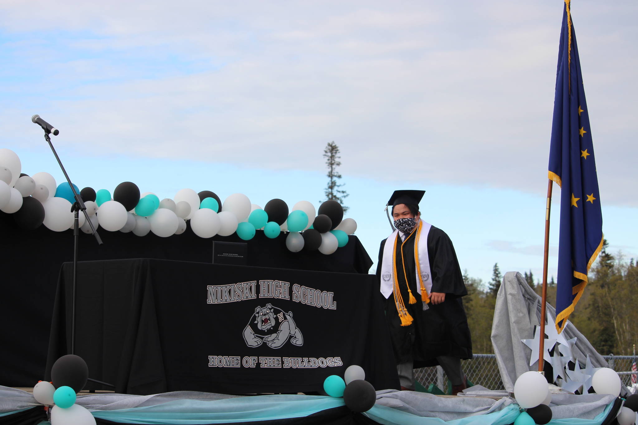 Senior Hamilton “Hammie” Cox walks onstage to receive his diploma during the 2020 Nikiski High School Graduation Commencement Ceremony in Nikiski, Alaska on May 19, 2020. (Photo by Brian Mazurek/Peninsula Clarion)
