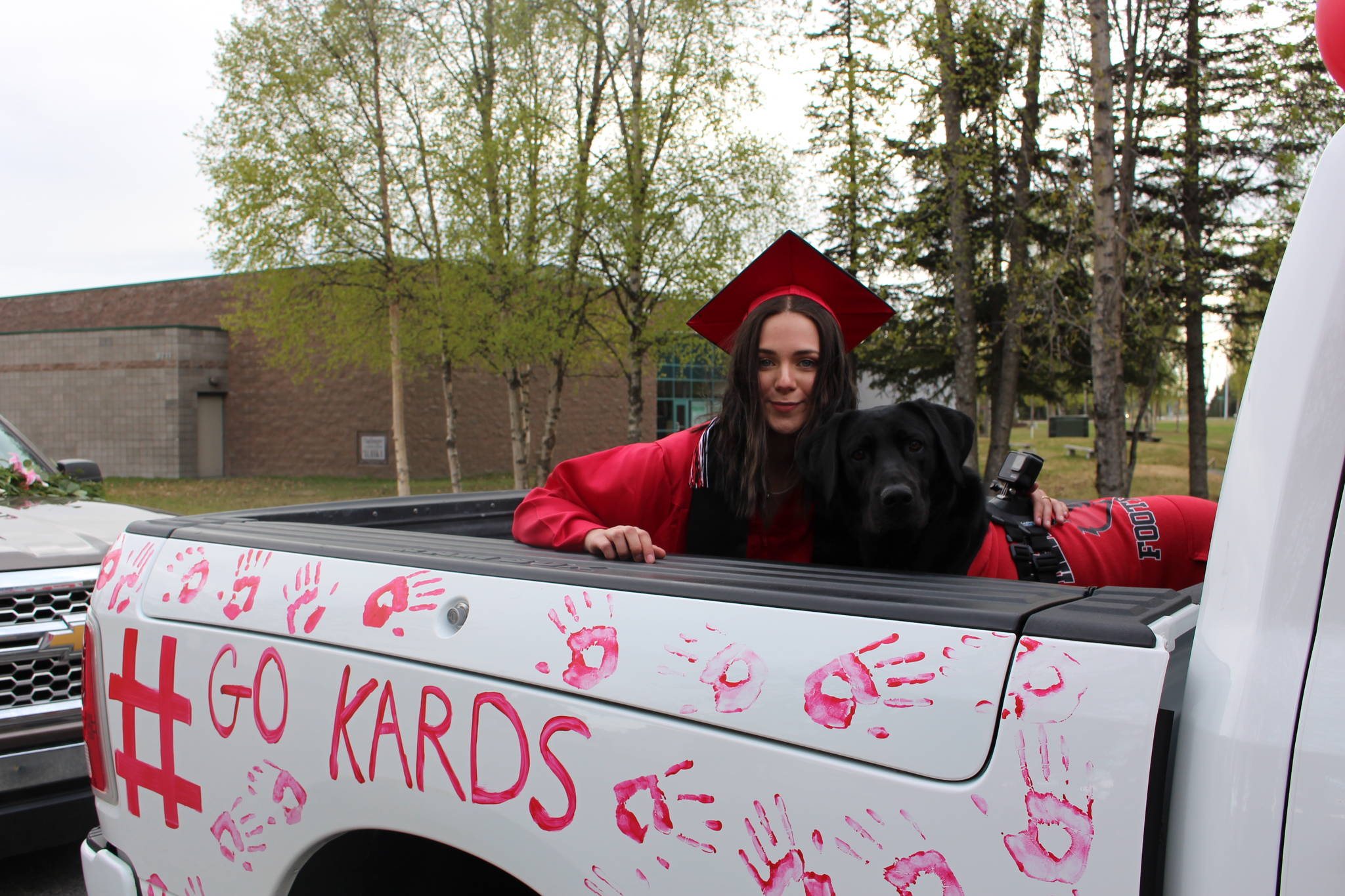 Senior Onaca Daniels and her dog Dez participate in Kenai Central High School’s Class of 2020 Graduation Parade in Kenai, Alaska, on May 20, 2020. (Photo by Brian Mazurek/Peninsula Clarion)