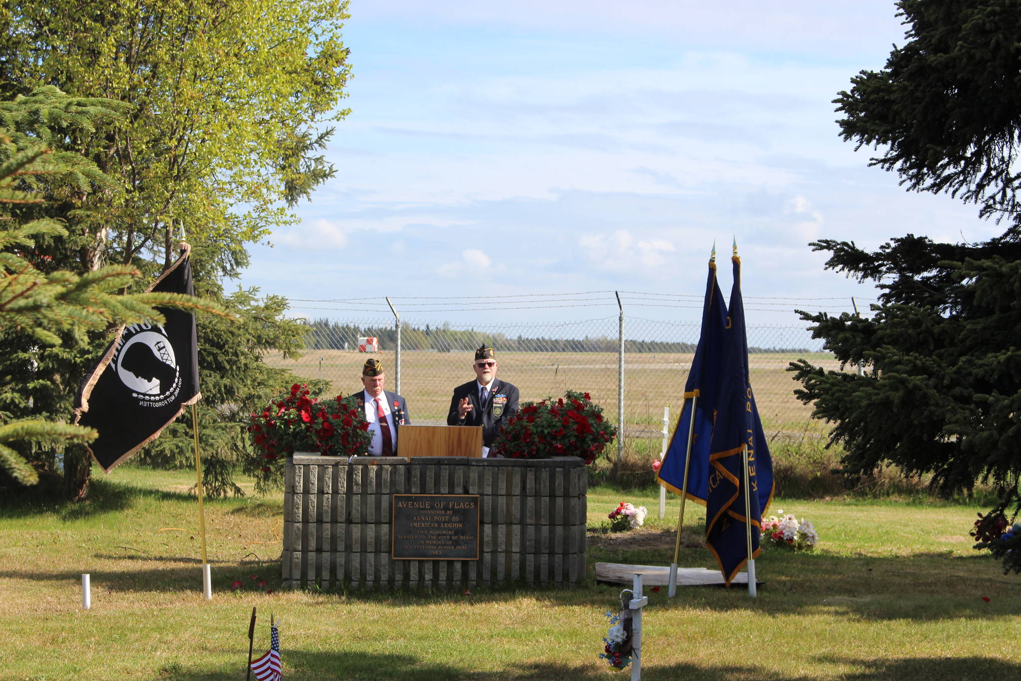 Mike Meredith and Greg Fite, members of the Kenai Post of the VFW, prepare to hold a Memorial Day ceremony at the Kenai Cemetery on May 25, 2020. (Photo by Brian Mazurek/Peninsula Clarion)
