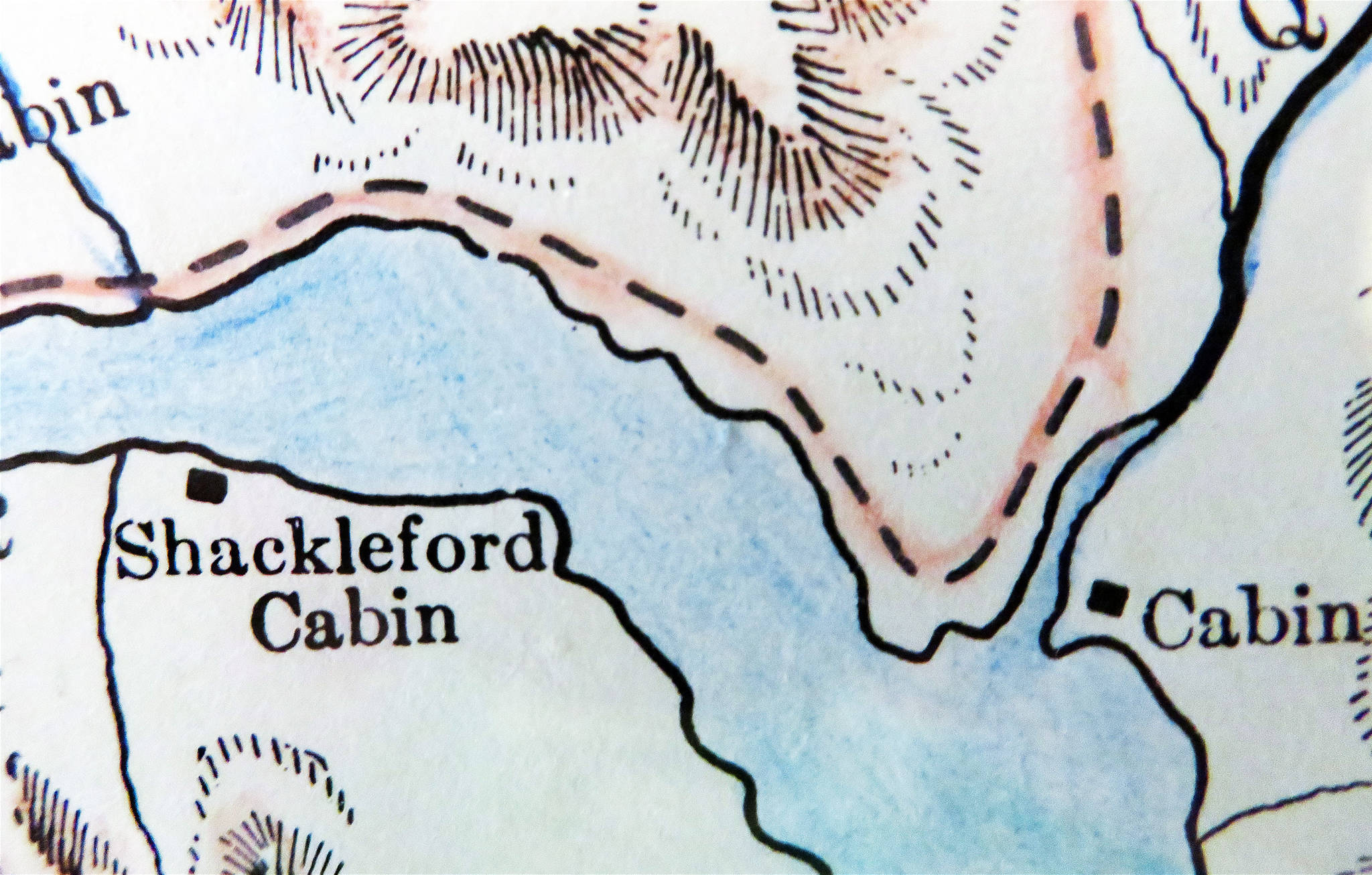 This enlarged section of Dr. David H. Sleem’s 1910 map of the Kenai Mining District shows the Shackleford Cabin just above the Kenai River outlet on lower Kenai Lake. The stream entering the lake at the far right is Quartz Creek.