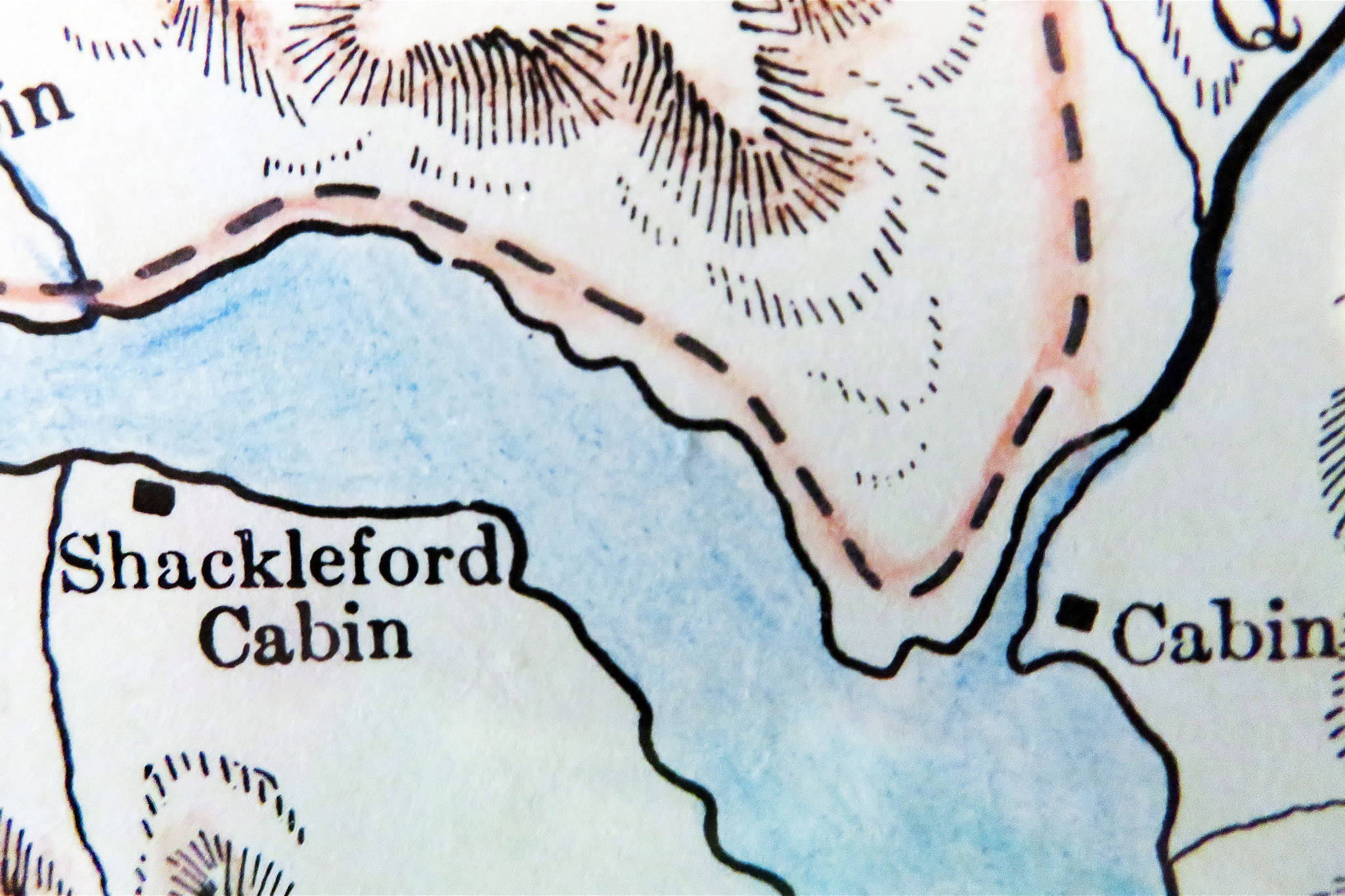 This enlarged section of Dr. David H. Sleem’s 1910 map of the Kenai Mining District shows the Shackleford Cabin just above the Kenai River outlet on lower Kenai Lake. The stream entering the lake at the far right is Quartz Creek.