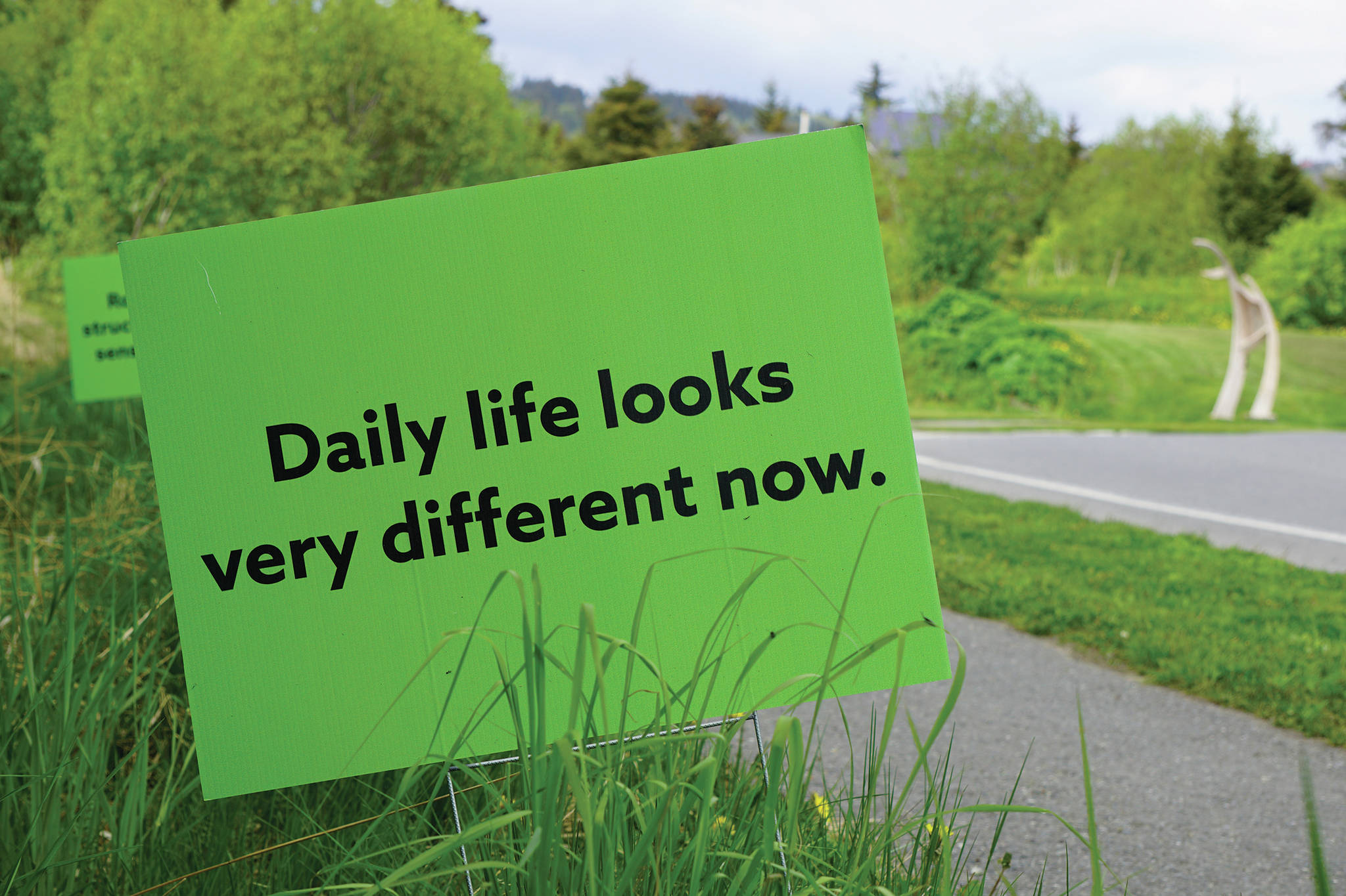 Signs along Poopdeck Street on Friday, May 29, 2020, in Homer, Alaska, offer inspiration during the COVID-19 pandemic. Put up by the South Kenai Peninsula Resiliency Coalition, the signs read “Daily life loooks very different now. Routine and structure create a sense of safety. How can your daily rhythm support you?” (Photo by Michael Armstrong/Homer News)