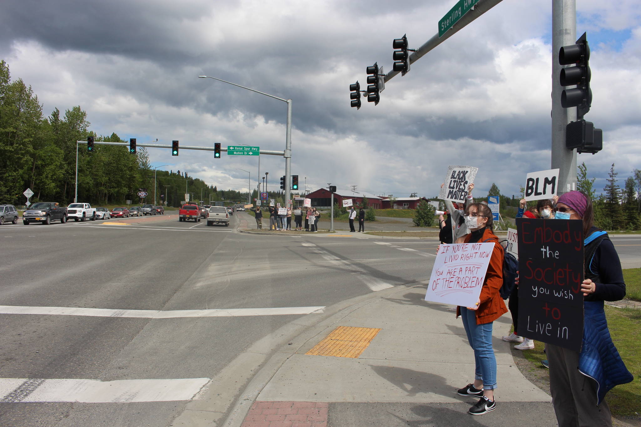 Participants in a Black Lives Matter protest stand at the “Y” intersection of the Kenai Spur and Sterling Highways in Soldotna, Alaska, on June 3, 2020. (Photo by Brian Mazurek/Peninsula Clarion)