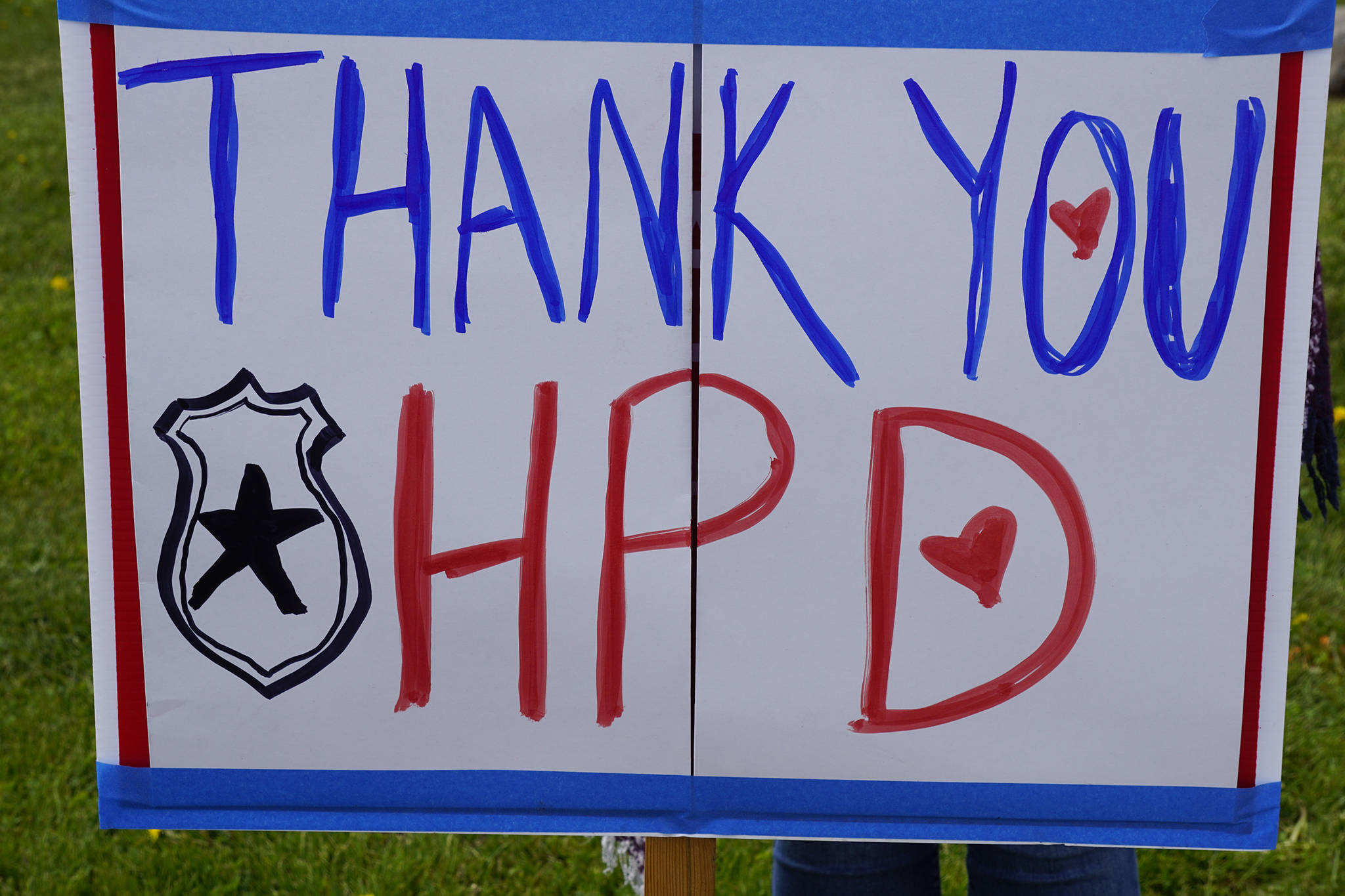 A sign at a protest on Sunday, May 30, 2020, at WKFL Park in Homer, Alaska, expresses appreciation to the Homer Police Department. People gathered in support of people of color who have been the subject of police violence, including George Floyd, a man who died May 25, 2020, in a police encounter in Minneapolis, Minnesota. (Photo by Michael Armstrong/Homer News)