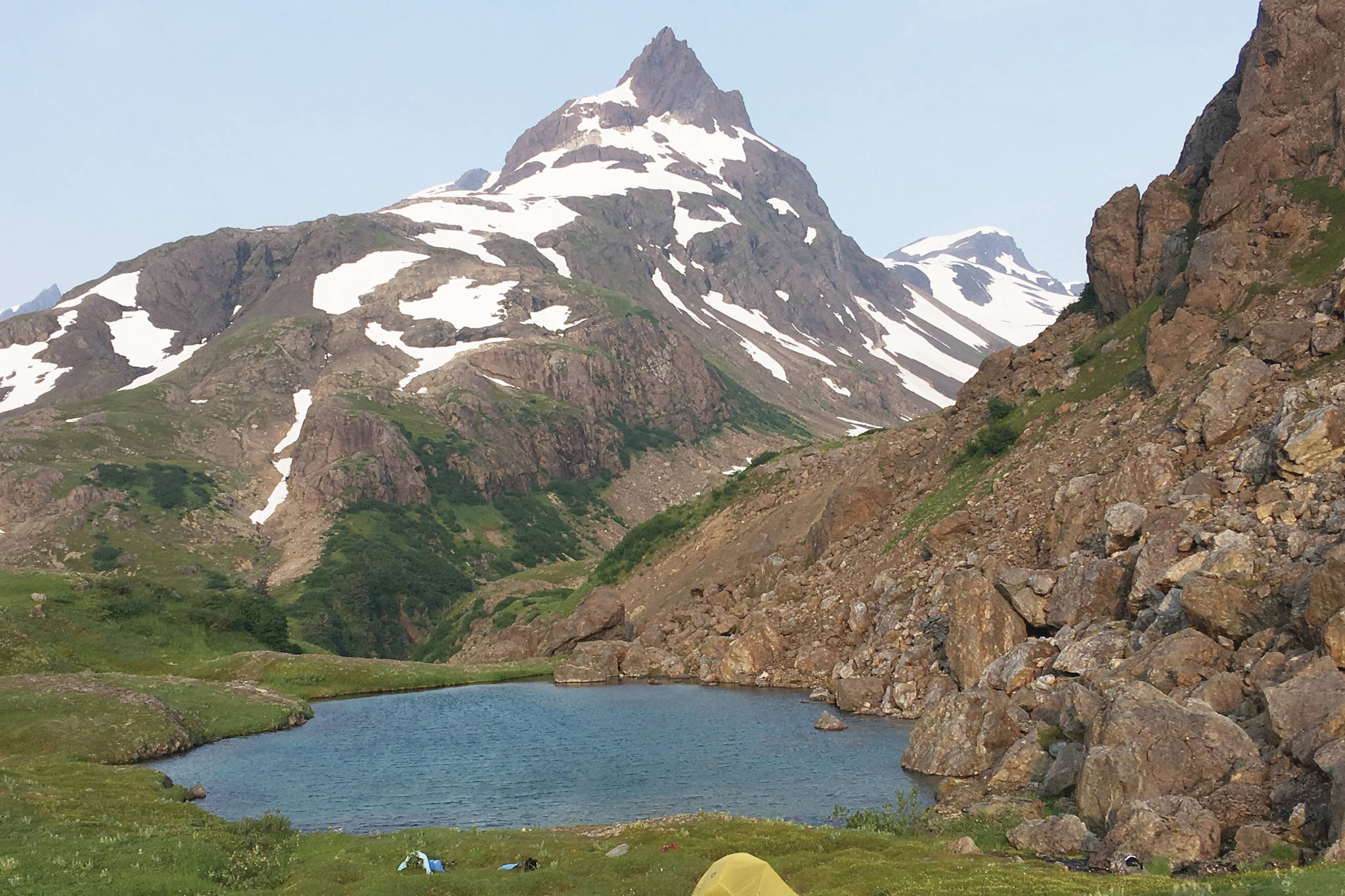 A pair of tents sits at the Infinity Pools above the Tutka Backdoor Trail in Kachemak Bay State Park on July 9, 2019. (Photo by Jeff Helminiak/Peninsula Clarion)