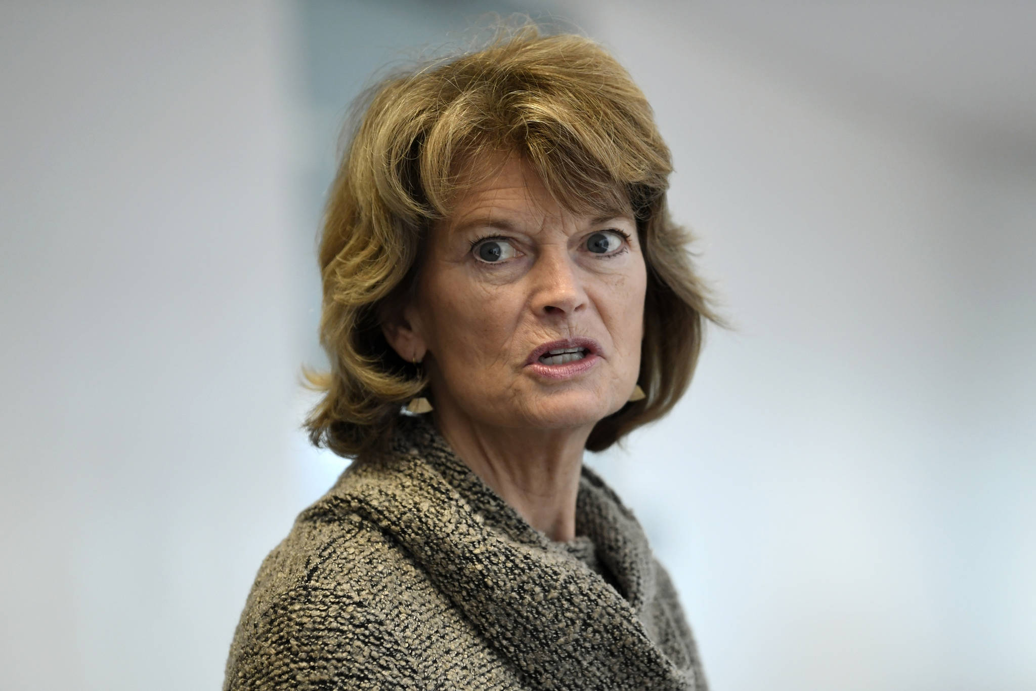In this March 19, 2020, file photo Sen. Lisa Murkowski, R-Alaska, talks with reporters following a Republican policy lunch on Capitol Hill in Washington. Murkowski acknowledged Thursday, June 4, that she’s “struggling” over whether she can support President Donald Trump given his handling of the virus and race crises shaking the United States. (AP Photo/Susan Walsh, File)