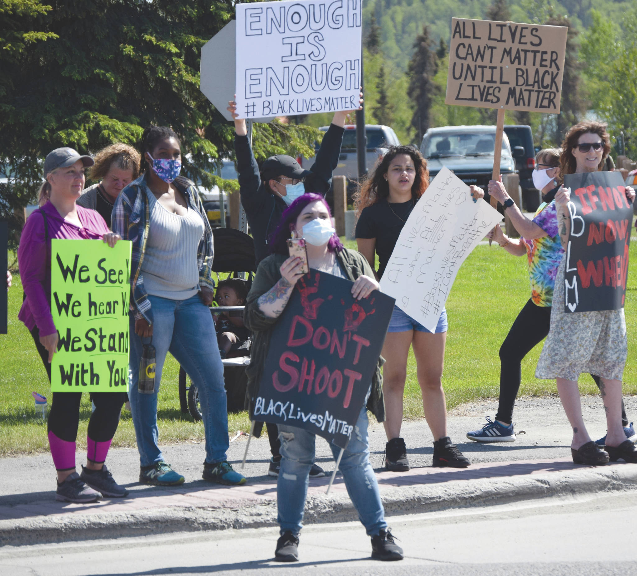 Faith Borromeo, main organizer of the Black Lives Matter protest in Soldotna, Alaska, stands on the Sterling Highway on Saturday, May 6, 2020. (Photo by Jeff Helminiak/Peninsula Clarion)