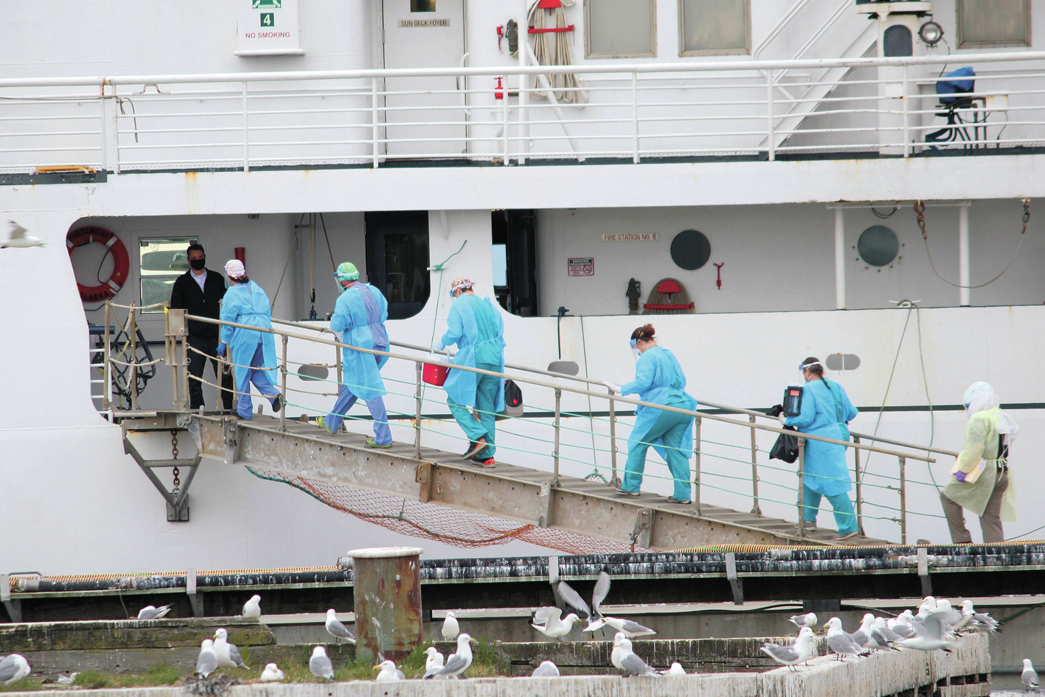 Staff from South Peninsula Hospital and Homer Public Health board the M/V Tustumena to test 35 crew members and six passengers Monday, at the Homer Ferry Terminal. (Photo by Megan Pacer/Homer News)