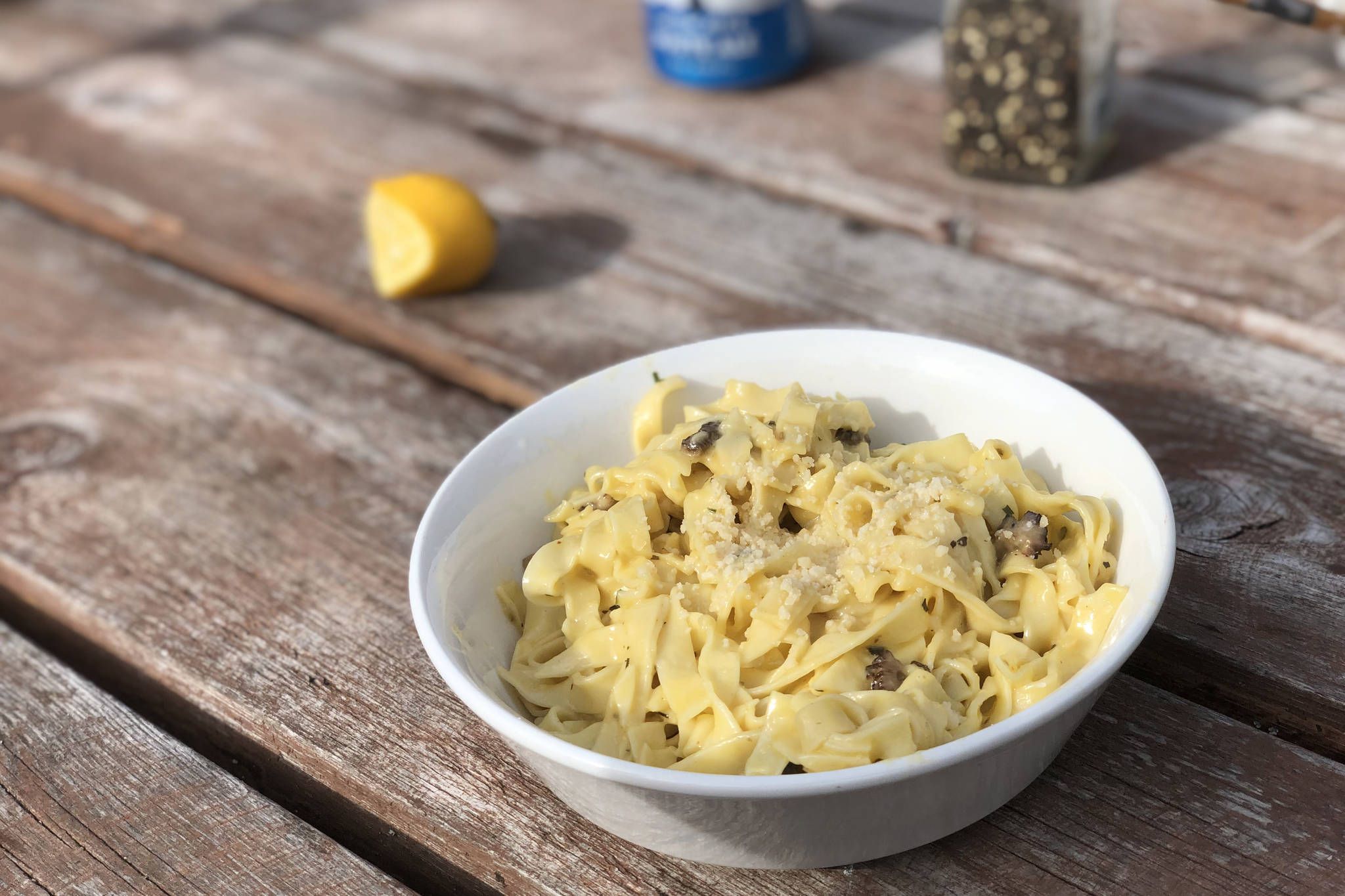 Morel pasta is enjoyed outside on May 19, 2019, near Kenai, Alaska. (Photo by Victoria Petersen/Peninsula Clarion)