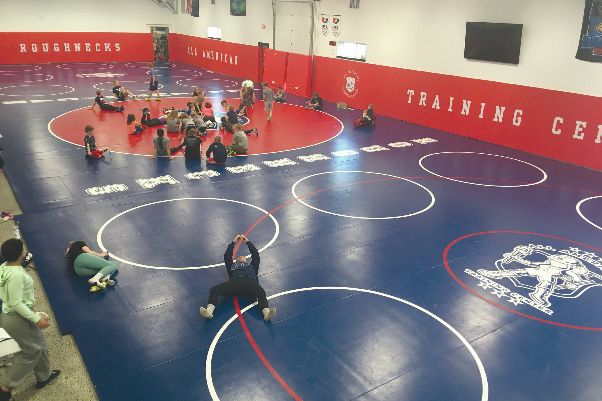 The three collegiate-size wrestling mats at the All American Training Center just outside of Soldotna, Alaska, take up about 7,000 square feet. Wrestlers from the Future of Champions camp use the facility Wednesday, June 10, 2020. (Photo by Jeff Helminiak/Peninsula Clarion)