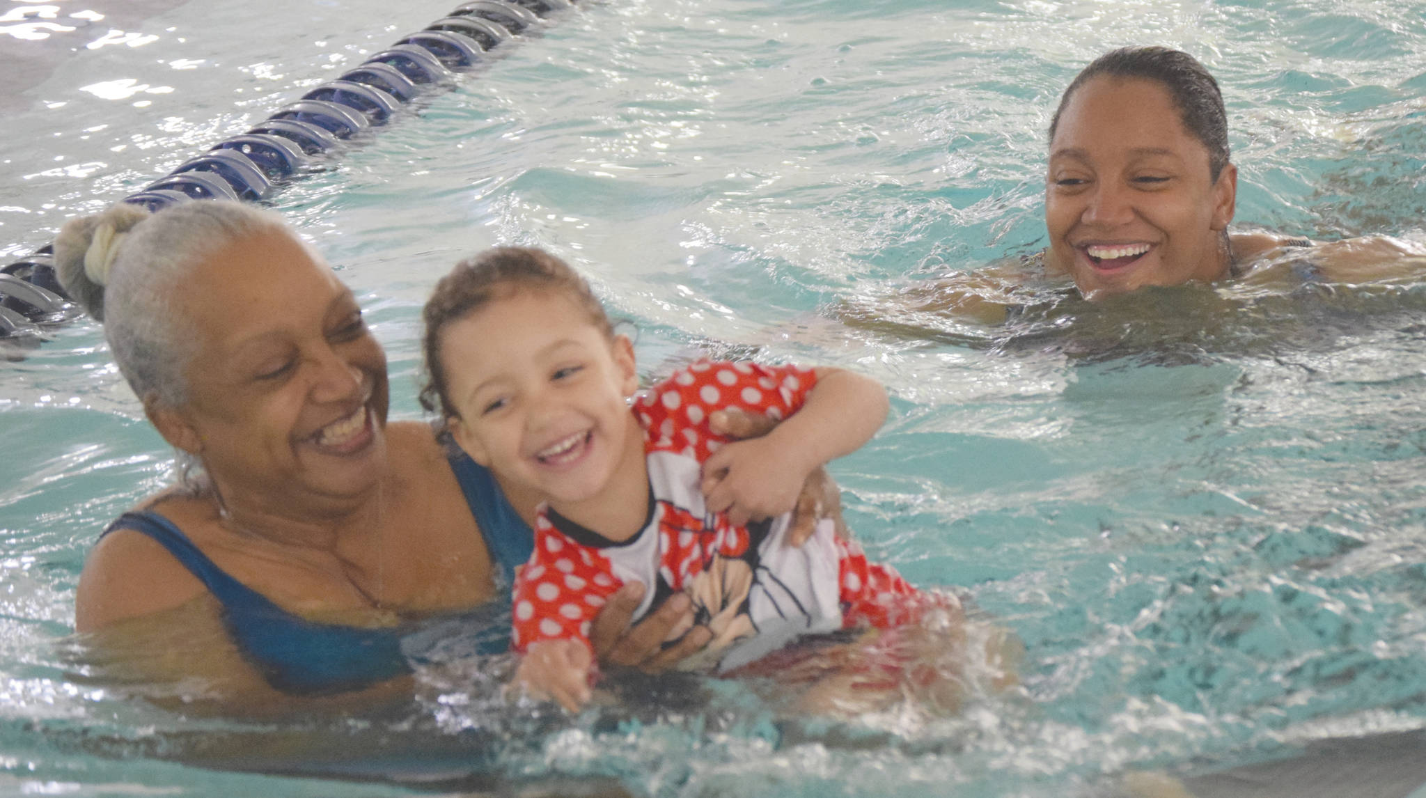 Photo by Jeff Helminiak/Peninsula Clarion                                Cheryl Arrington, Finley Hendrickson and JJ Hendrickson swim at the Nikiski Pool in Nikiski on Friday, June 12. Arrington is Finley’s grandmother, while JJ is Finley’s mother. The family were celebrating JJ’s birthday.