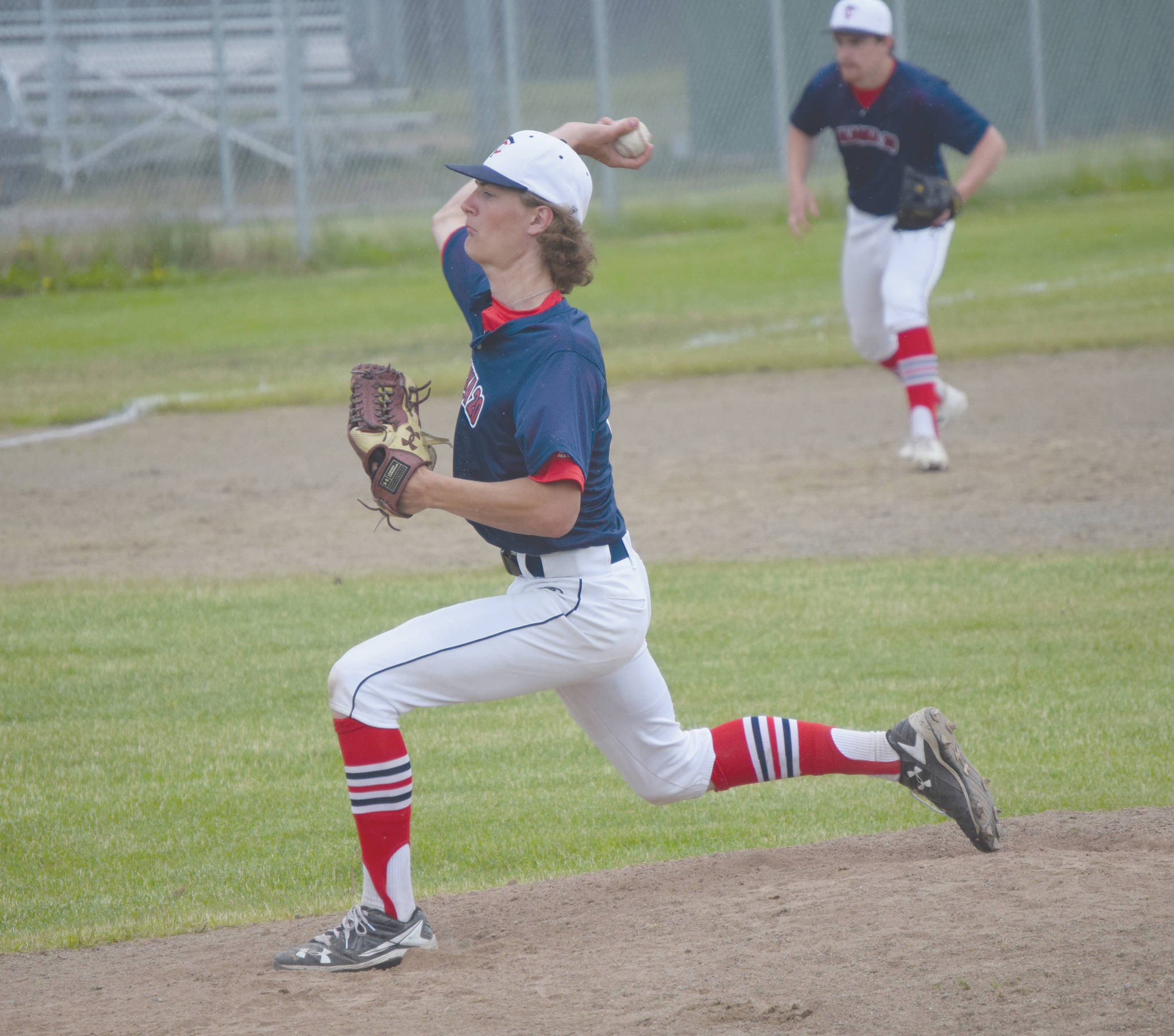Alaska 20 relief pitcher Davey Belger delivers to Service on Tuesday, June 23, 2020, at the Kenai Little League fields in Kenai, Alaska. (Photo by Jeff Helminiak/Peninsula Clarion)