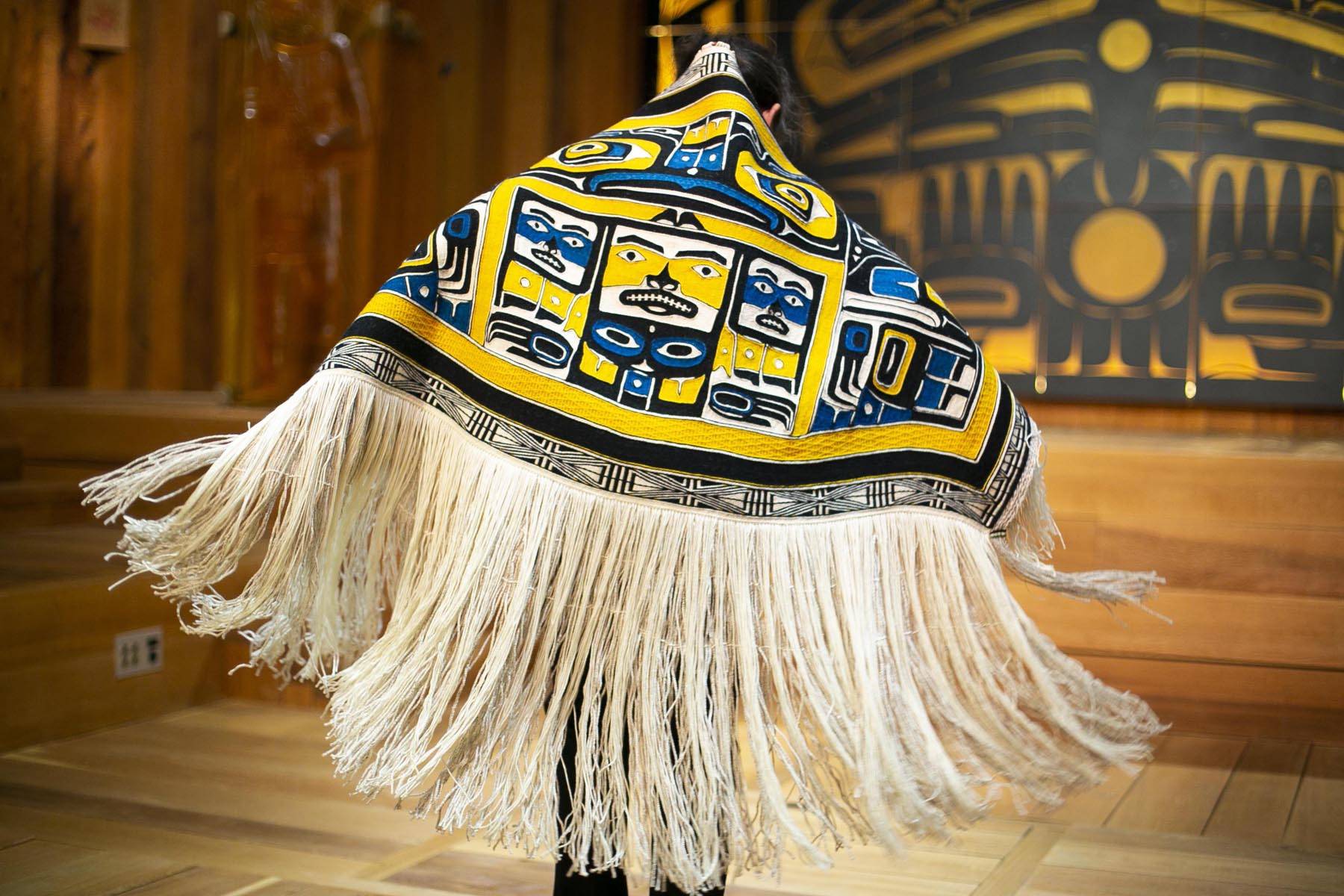 Courtesy photo | Annie Bartholomew                                Lily Hope and Ricky Tagaban, two of Juneau’s preeminent Chilkat and Ravenstail-style weavers, celebrated the completion of a robe Monday in Juneau. The first dance honors the journey of the weavers and blanket. See Arts on Page A10