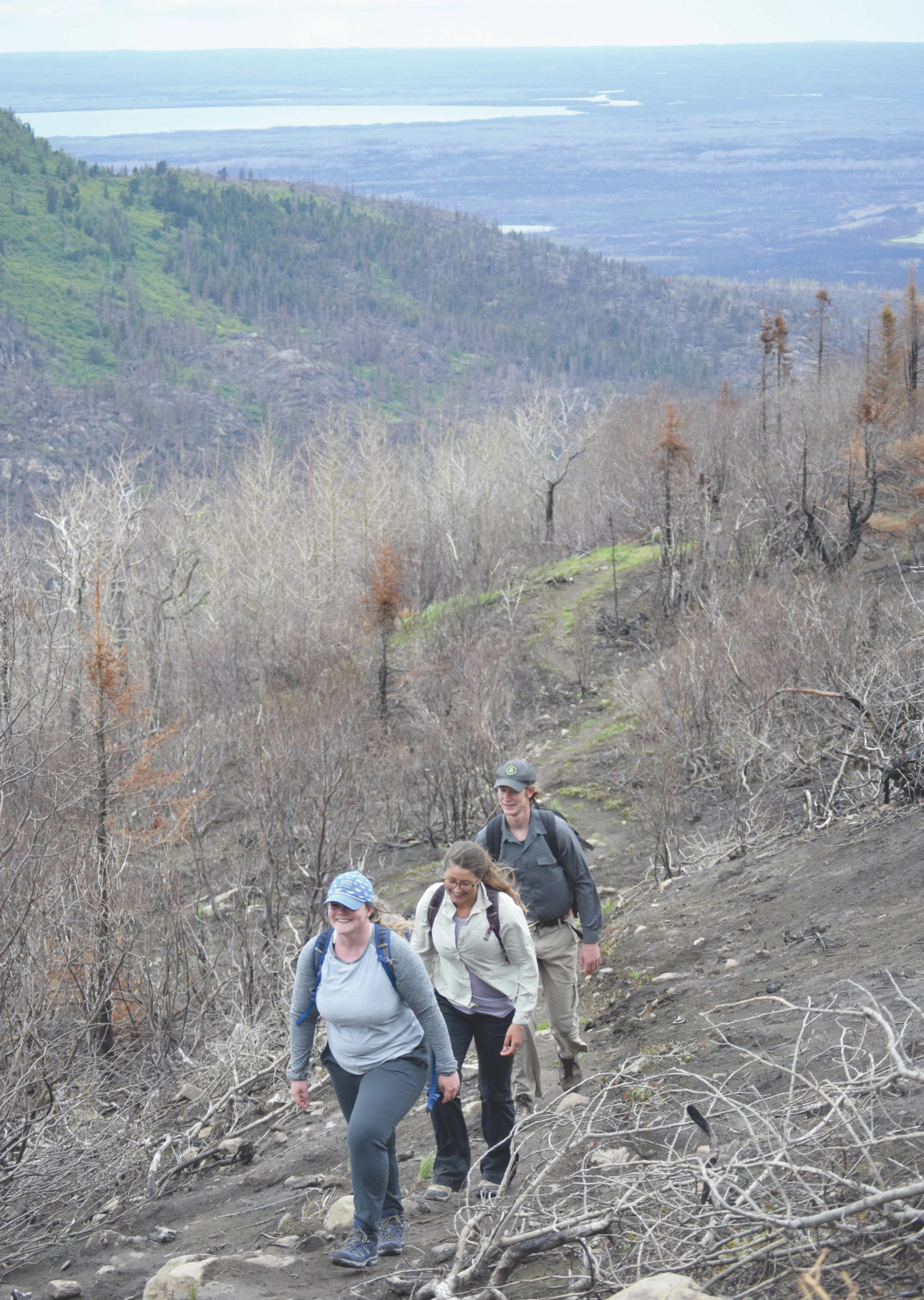 Jeff Helminiak / Peninsula Clarion                                 Cassie Sheridan, of Anchorage, and Meghan White and Drew Schaller, of Carlsbad, California, hike Skyline Trail on Sunday.