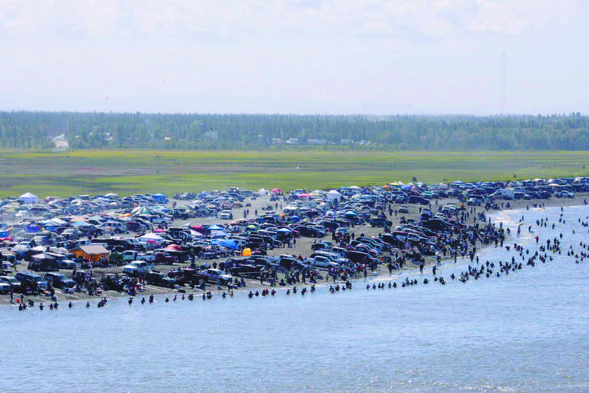 In this July 20, 2013 file photo, several thousand dipnetters converged onto the mouth of the Kenai River to catch a share of the late run of sockeye salmon headed into the river in Kenai, Alaska. (Peninsula Clarion file photo/Rashah McChesney)