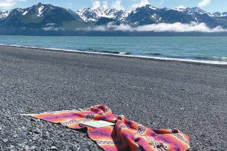 Along the shores of Resurrection Bay is a good place to read a good book. (Photo by Kat Sorensen)