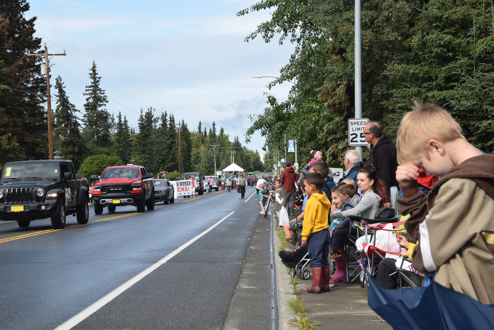 Onlookers await the passing of parade floats at the Progress Days Parade in Soldotna on July 27, 2019. (Photo by Brian Mazurek/Peninsula Clarion)