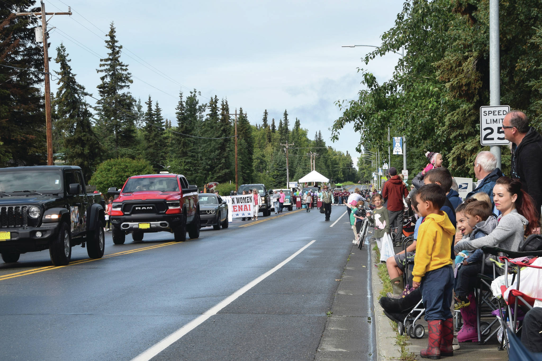 Brian Mazurek/Peninsula Clarion                                 Onlookers await the passing of parade floats at the Progress Days Parade in Soldotna on July 27, 2019.
