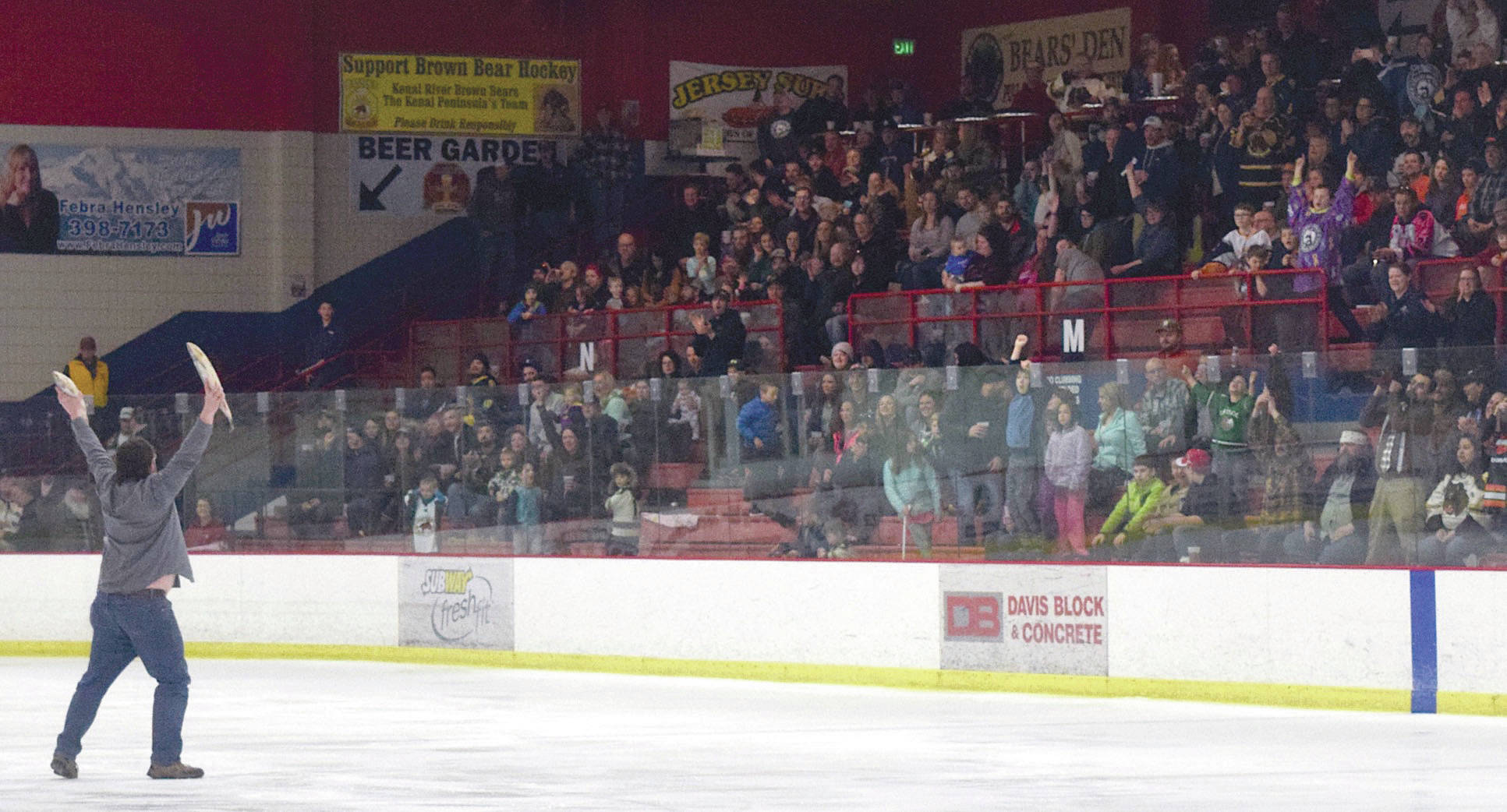 Jeff Helminiak / Peninsula Clarion Brown Bears fans celebrate Luke Radetics goal in the third period by throwing the customary fish on the ice Friday, March 24, 2017, at the Soldotna Regional Sports Complex.