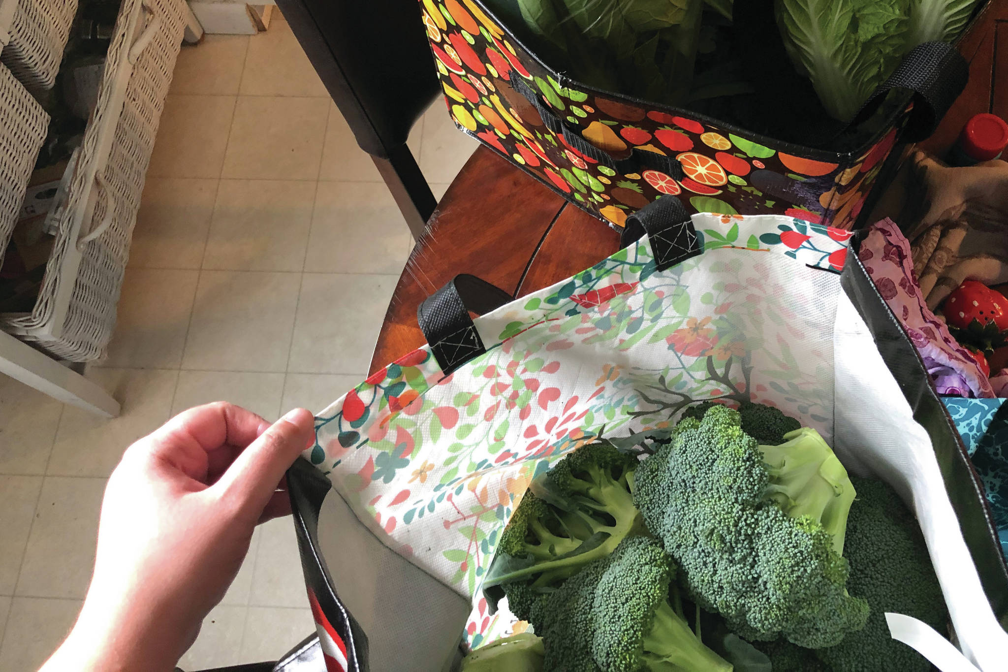 A bag full of fresh broccoli is seen in the author’s kitchen in Anchorage, Alaska, in August 2020. (Photo by Victoria Petersen/Peninsula Clarion)