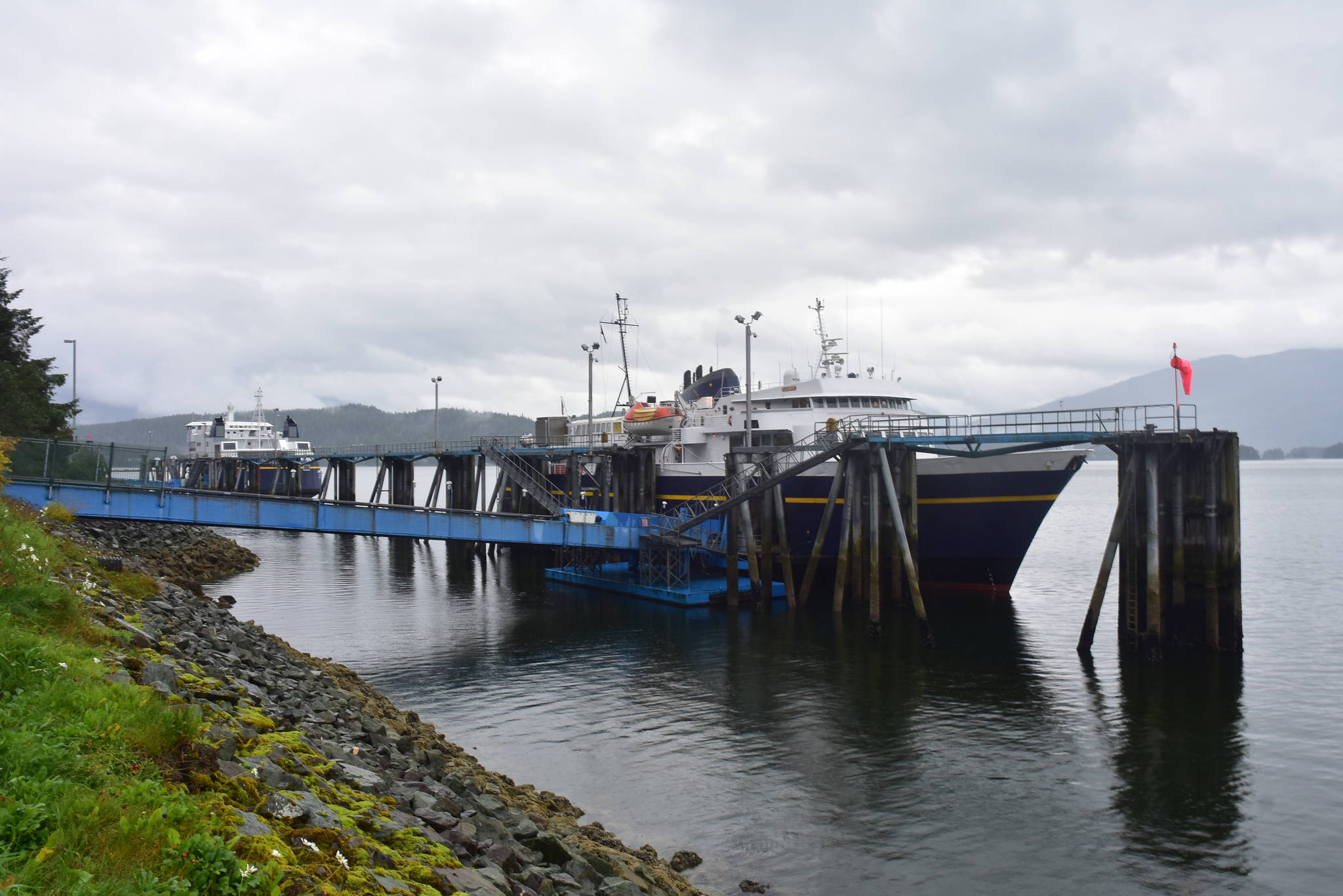 MV LeConte docks at the Auke Bay Ferry Terminal with the MV Tazlina in the background on Monday, Aug. 10, 2020. A crew member who recently finished a shift aboard the LeConte tested positive for COVID-19 after returning home, the Department of Transportation and Public Facilities announced Monday. (Peter Segall / Juneau Empire)